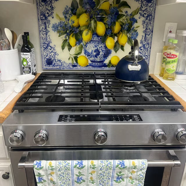 Mediterranean lemon and blue vase glass backsplash in a kitchen