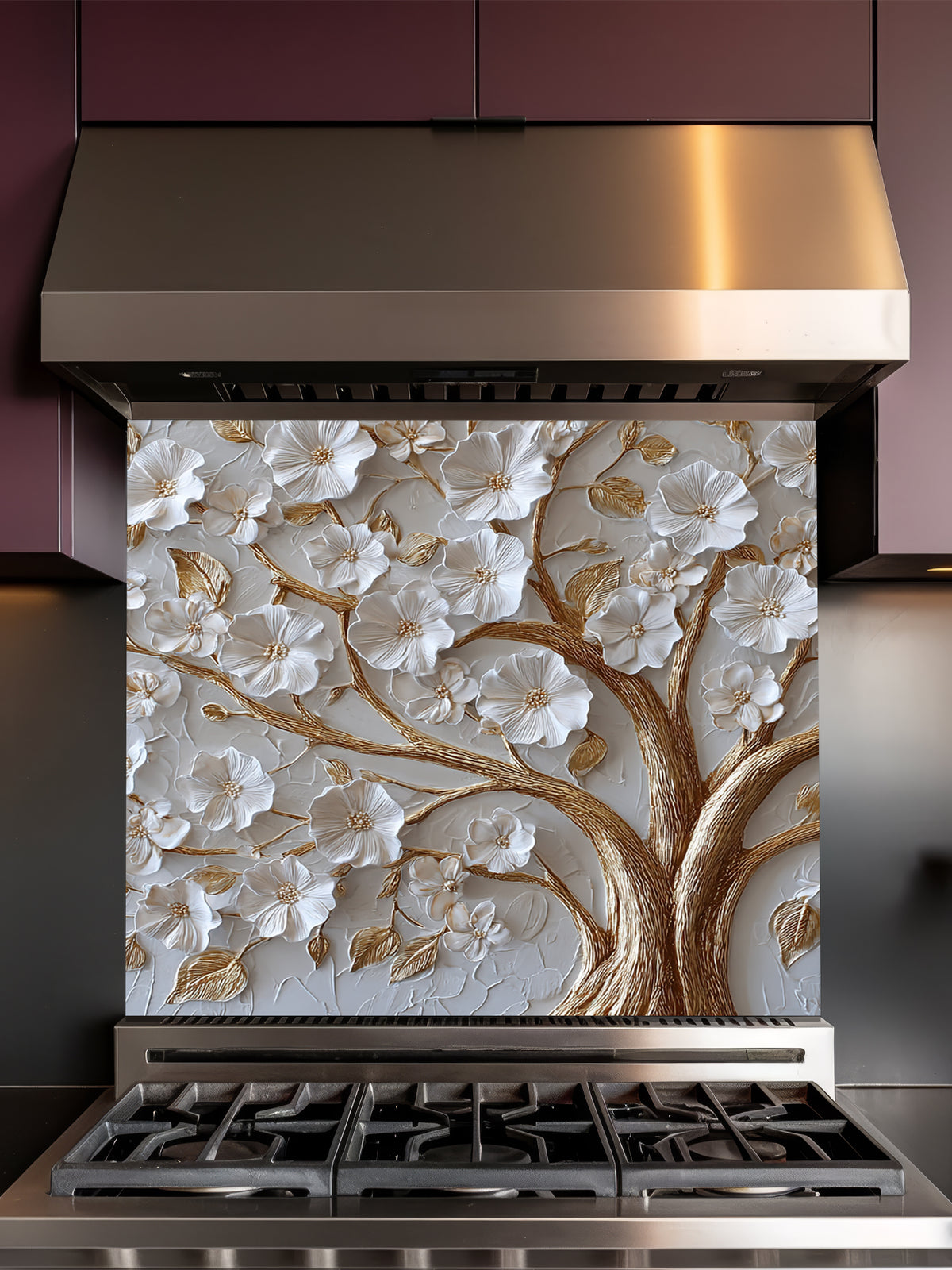 Faux 3D sculpted relief of a floral tree with pearl-white blossoms and heavy molten gold branches on a textured champagne background, UV printed on a smooth tempered glass kitchen backsplash.