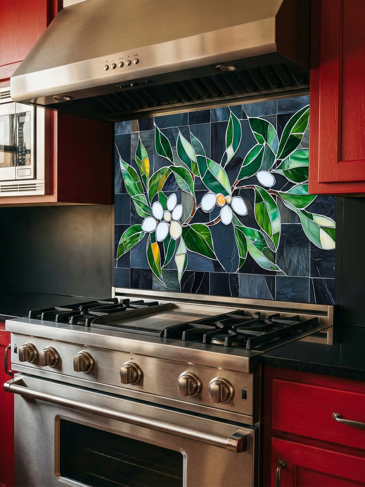 Tempered glass kitchen backsplash featuring a highly realistic 3D illusion of stained glass white blossoms and emerald green leaves integrated into a background of dark charcoal grey textured slate tiles, installed behind a modern black stove.