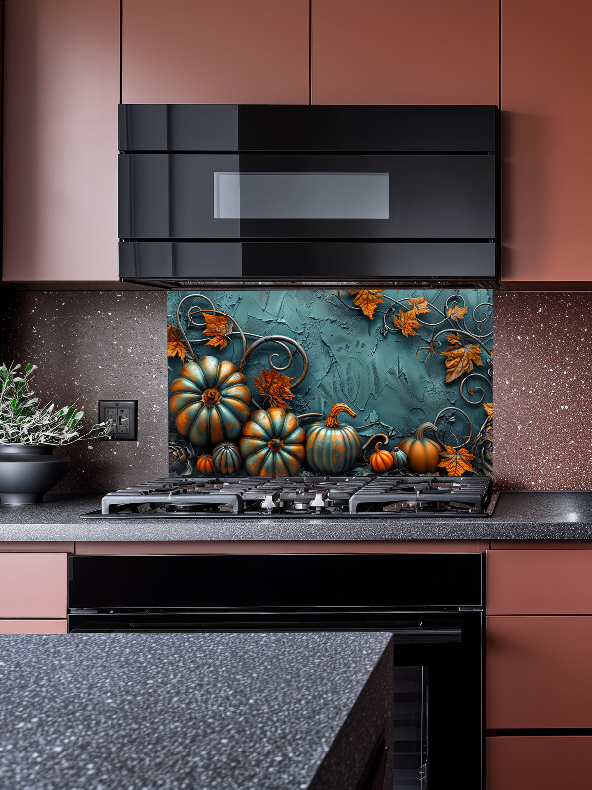 Tempered glass kitchen backsplash featuring a highly realistic 3D illusion of embossed teal and orange pumpkins surrounded by whimsical copper vines and autumn leaves against a textured dark teal background, installed behind a modern black stove.