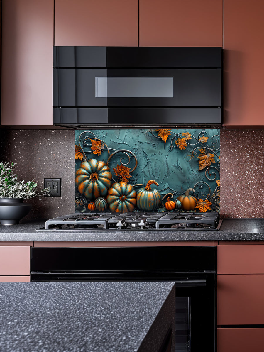 Tempered glass kitchen backsplash featuring a highly realistic 3D illusion of embossed teal and orange pumpkins surrounded by whimsical copper vines and autumn leaves against a textured dark teal background, installed behind a modern black stove.