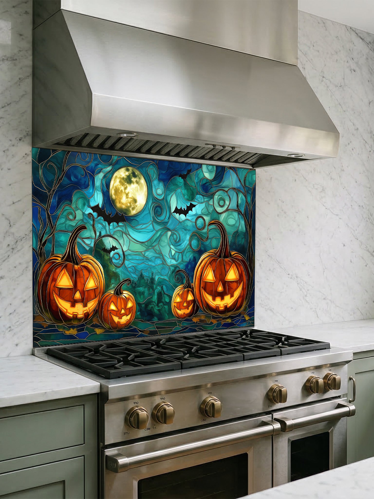 Stainless steel kitchen stove with a decorative backsplash featuring pumpkins and a moon.