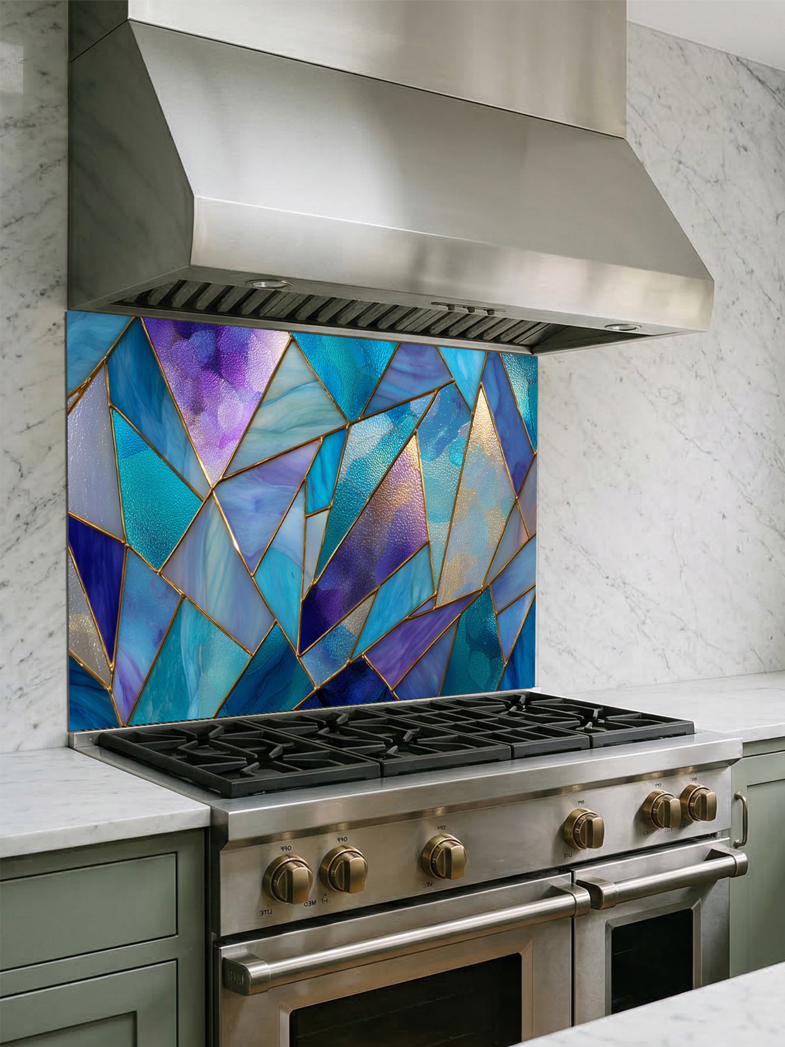 Tempered glass kitchen backsplash featuring a vibrant geometric stained glass effect with blue, teal, and purple shards separated by gold lines, installed behind a modern stainless steel stove.