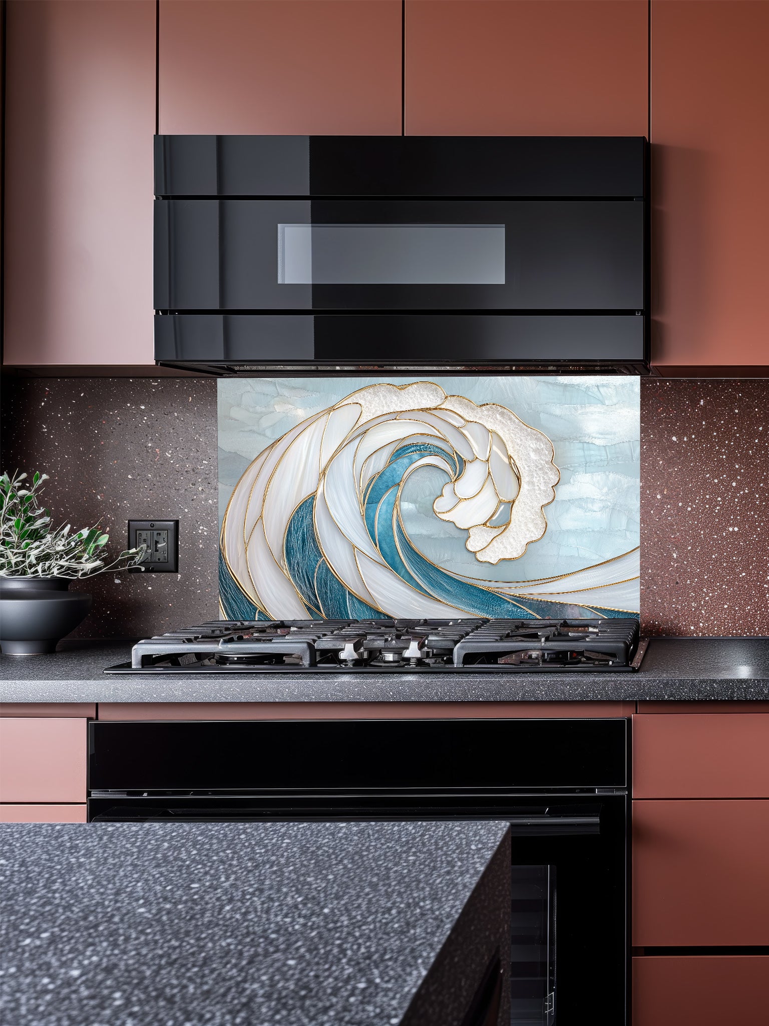 Kitchen with a decorative glass splashback featuring a wave design.