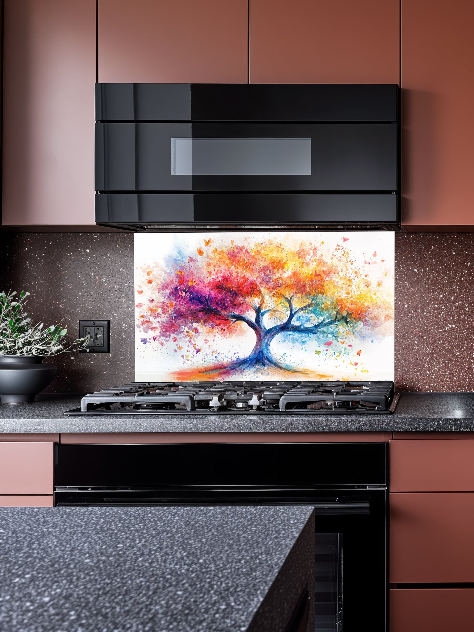 Vibrant watercolor style Tree of Life with colorful paint splatters in rainbow hues, UV printed on a smooth tempered glass kitchen backsplash.