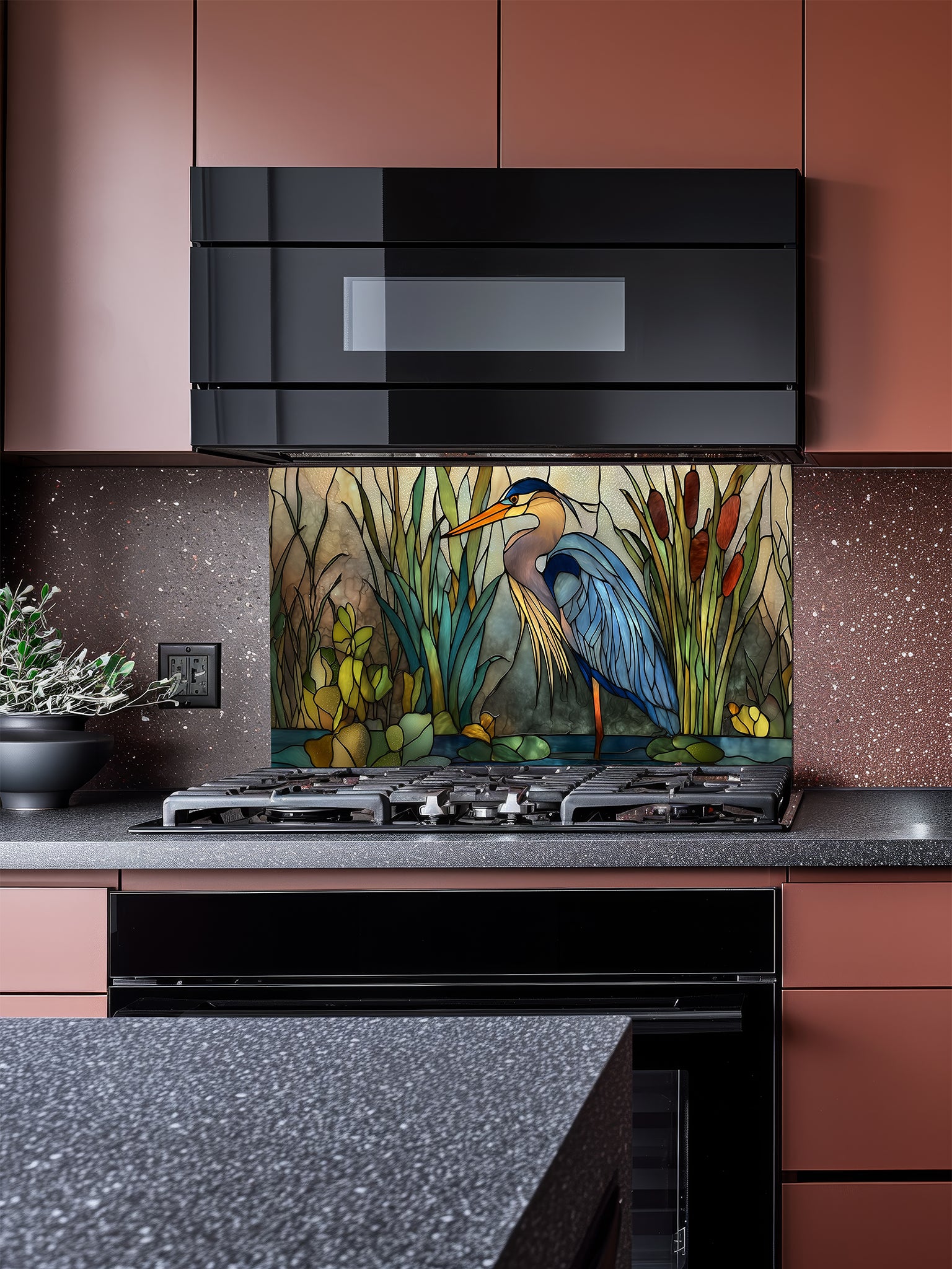 Tempered glass kitchen backsplash featuring a serene faux stained glass design of a majestic blue heron standing in a wetland with cattails and lily pads, installed behind a modern stainless steel stove.