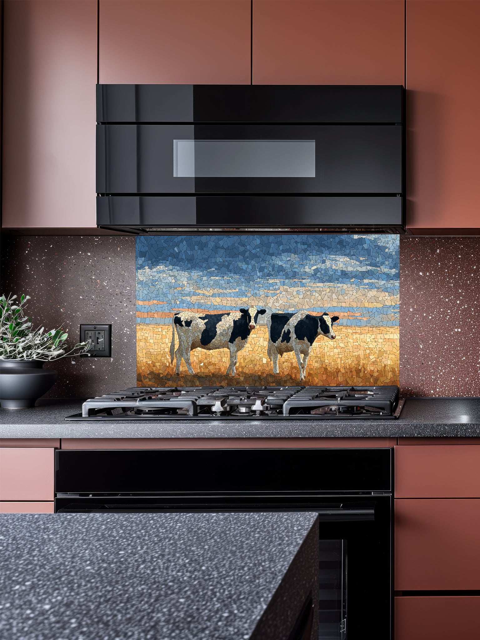 Faux mosaic tile art of black and white cows standing in a golden pasture under a blue sky, UV printed on a smooth tempered glass kitchen backsplash, installed behind a modern stove.