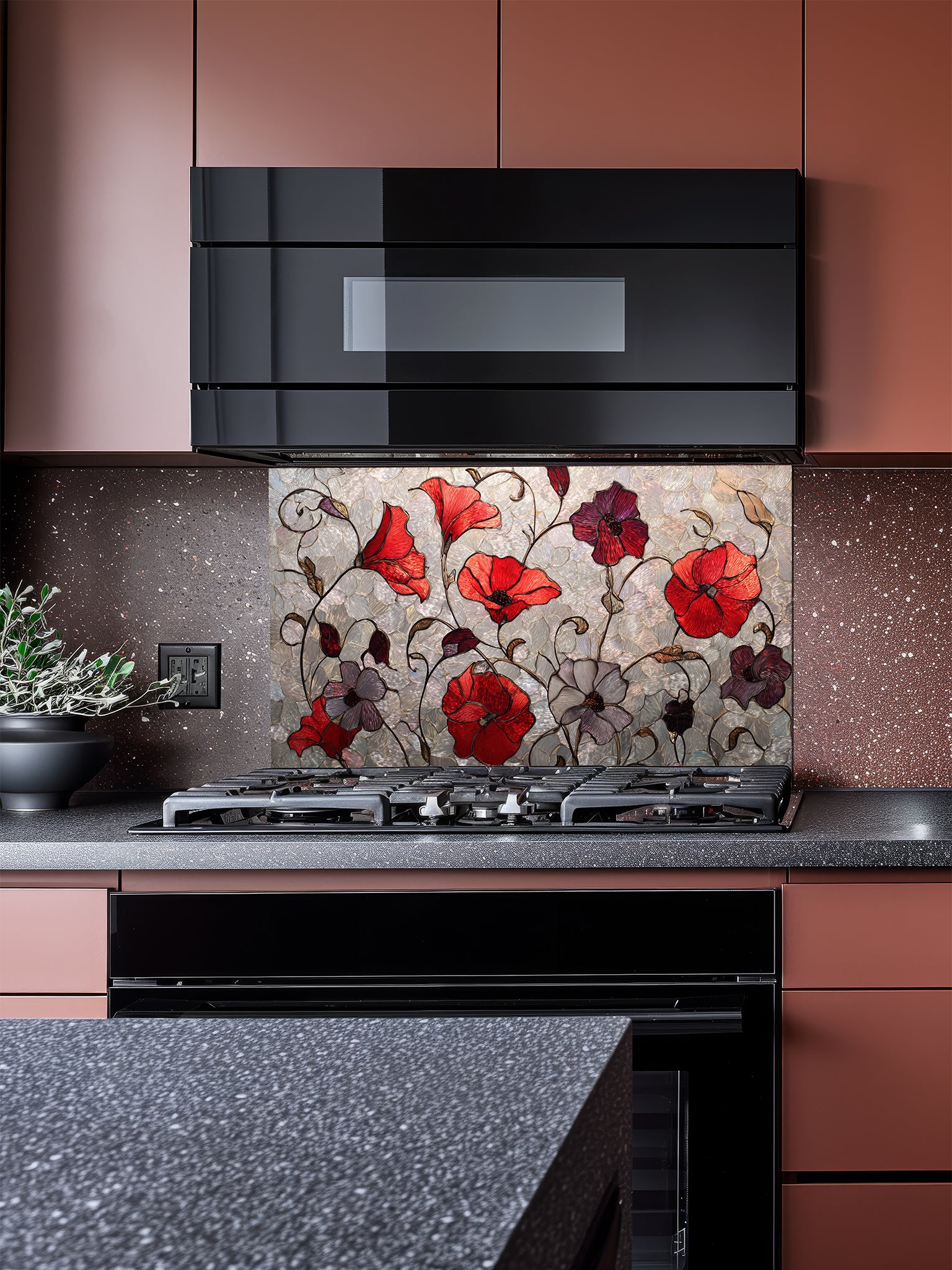 Tempered glass kitchen backsplash featuring a faux stained glass design of vibrant red and purple poppy flowers with elegant curving stems against a textured silver mosaic background, installed behind a modern stainless steel stove.