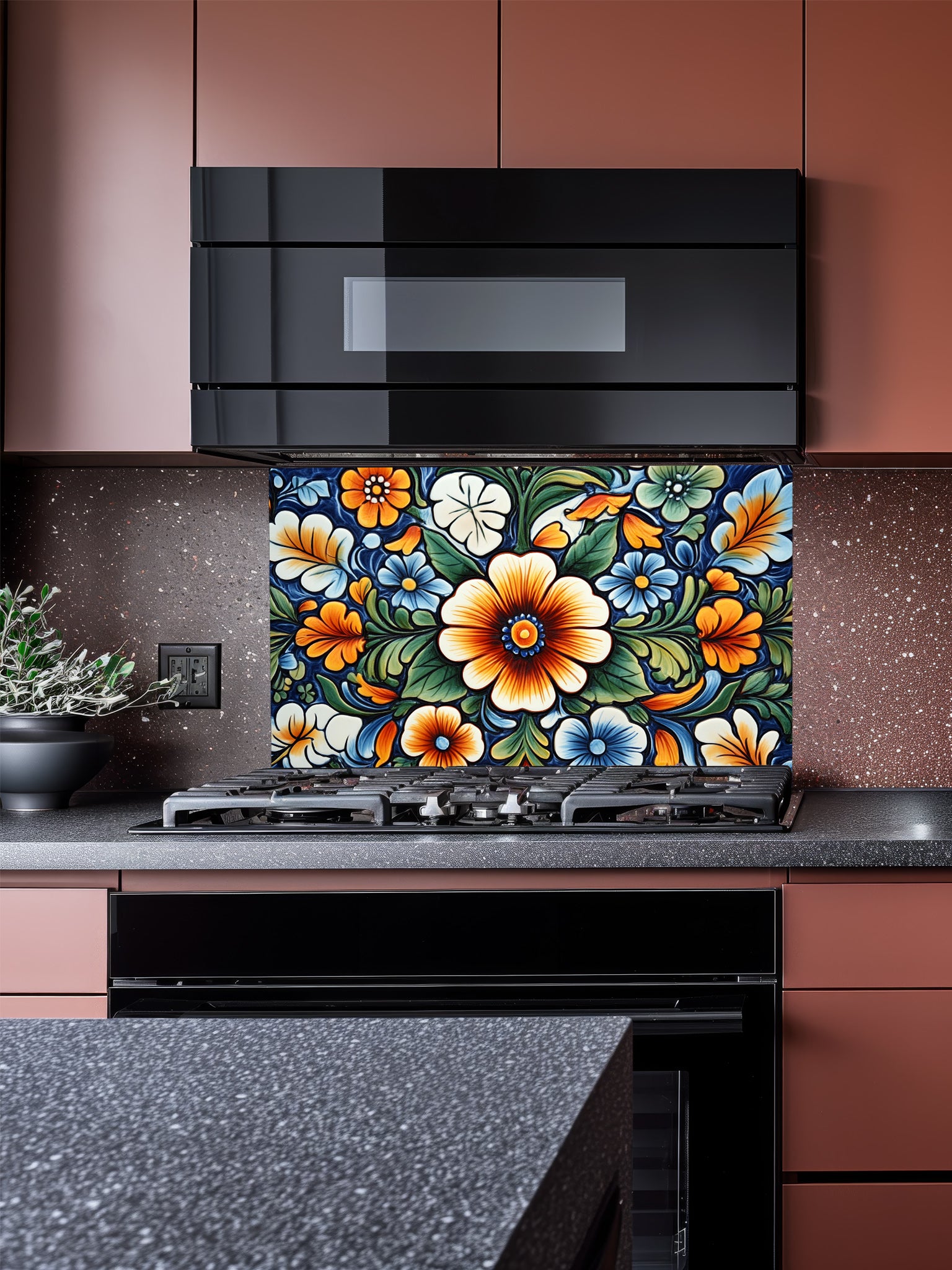 Vibrant Mexican Talavera style floral pattern in blue, orange, and green, UV printed on a smooth tempered glass kitchen backsplash, installed behind a modern stove.