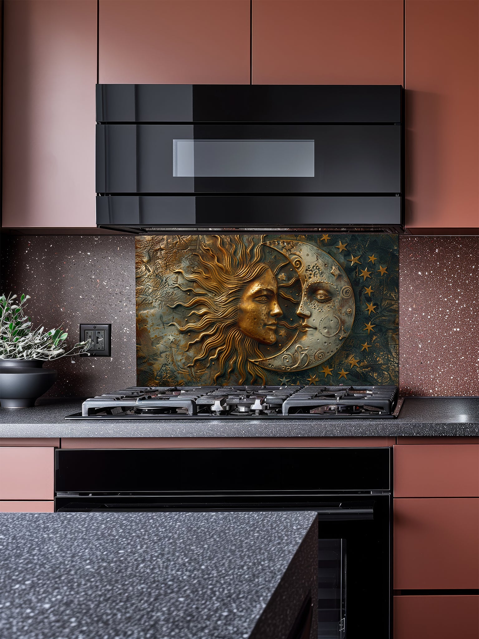 Tempered glass kitchen backsplash featuring a highly realistic 3D faux metal design of a celestial sun and moon with stars in antique bronze, gold, and oxidized silver tones, installed behind a modern stainless steel stove.
