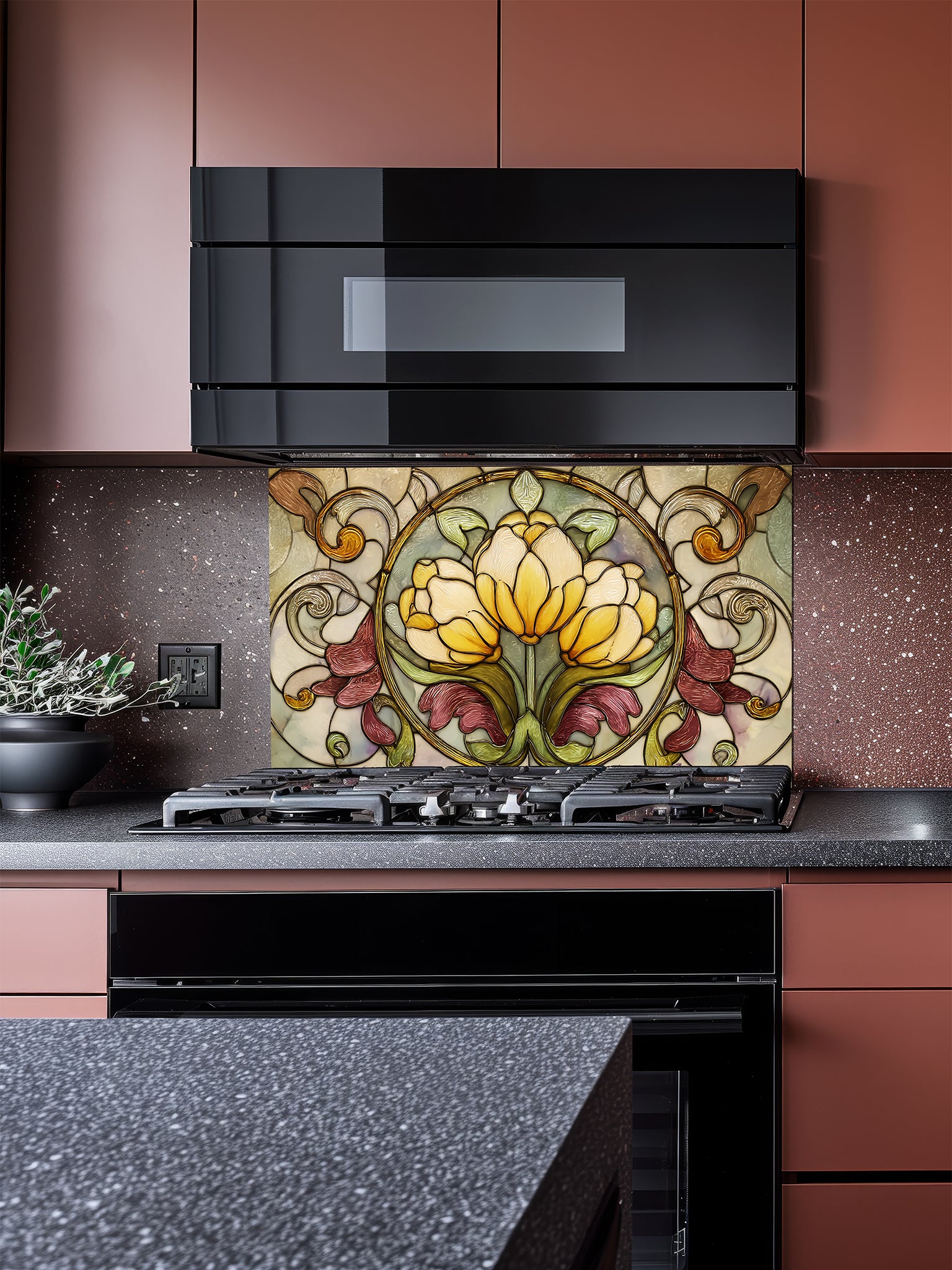 Tempered glass kitchen backsplash featuring a highly realistic faux stained glass design with a central medallion of yellow tulips surrounded by ornate Art Nouveau vines in green and burgundy, installed behind a modern stainless steel stove.