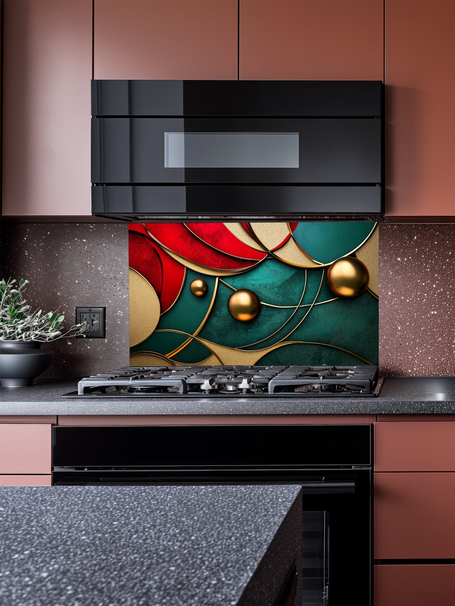 Tempered glass kitchen backsplash featuring a highly realistic 3D illusion of abstract overlapping geometric circles and waves in rich ruby red and emerald green with striking gold outlines and floating 3D metallic gold spheres, installed behind a modern stainless steel stove.