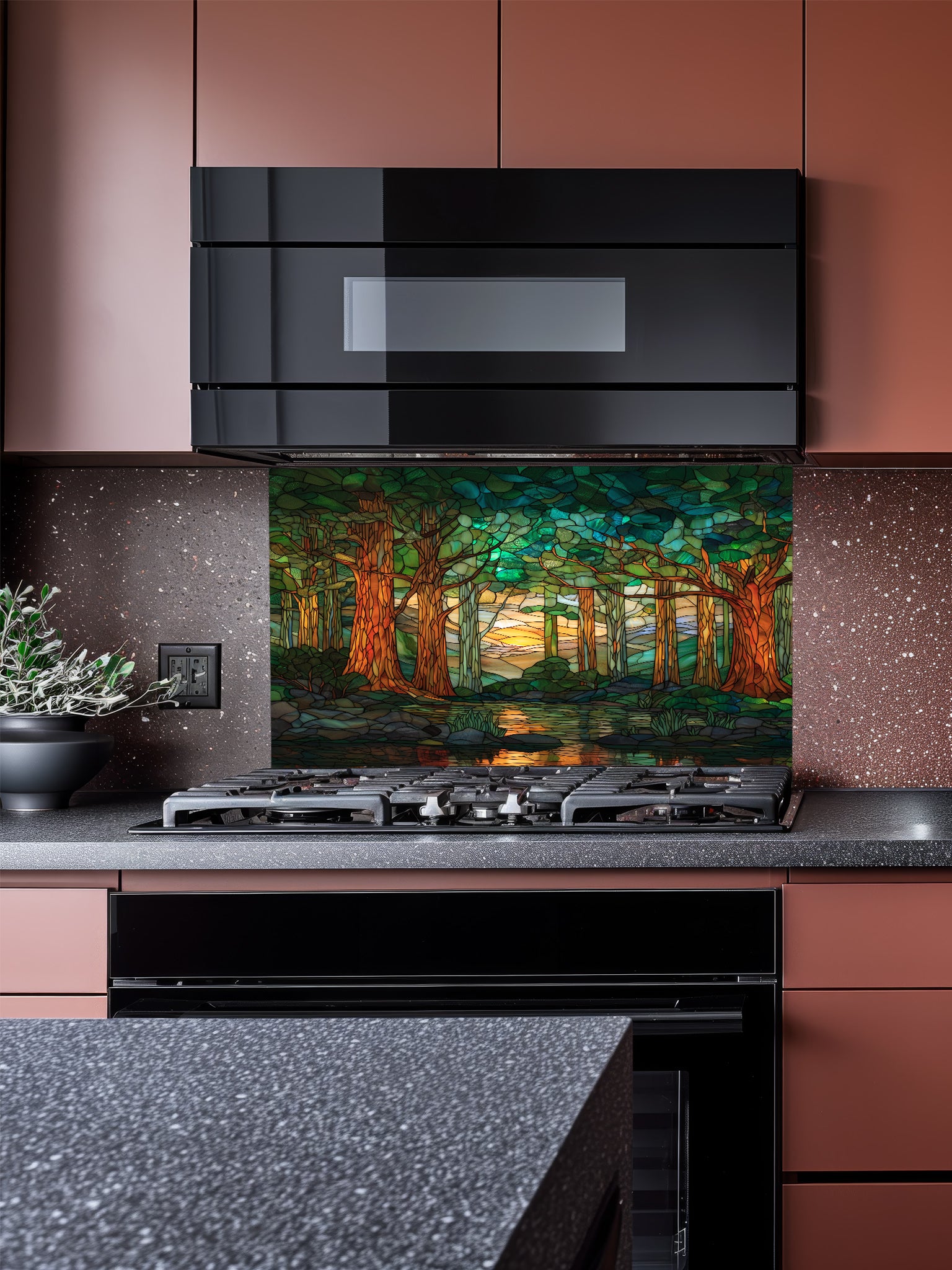 A modern kitchen featuring a tempered glass backsplash with a beautiful stained glass effect landscape, showcasing a lush green forest, tall trees, and a tranquil river at sunset, installed behind a modern black stove.
