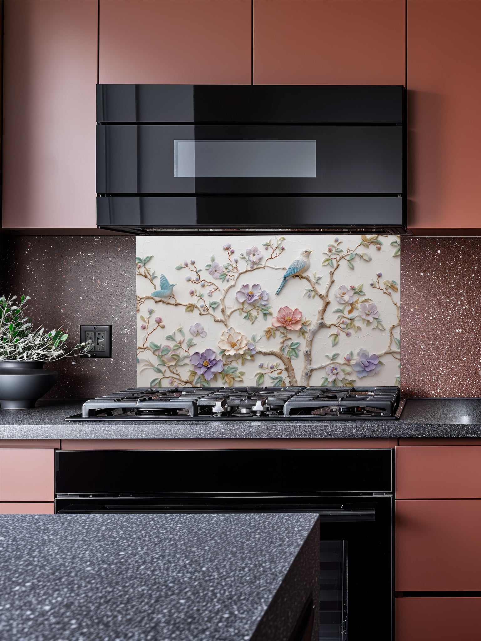 Tempered glass kitchen backsplash featuring a highly realistic 3D illusion of bas-relief plaster art with pastel blooming flowers and light blue birds perched on branches against a white textured background, installed behind a modern stainless steel stove.
