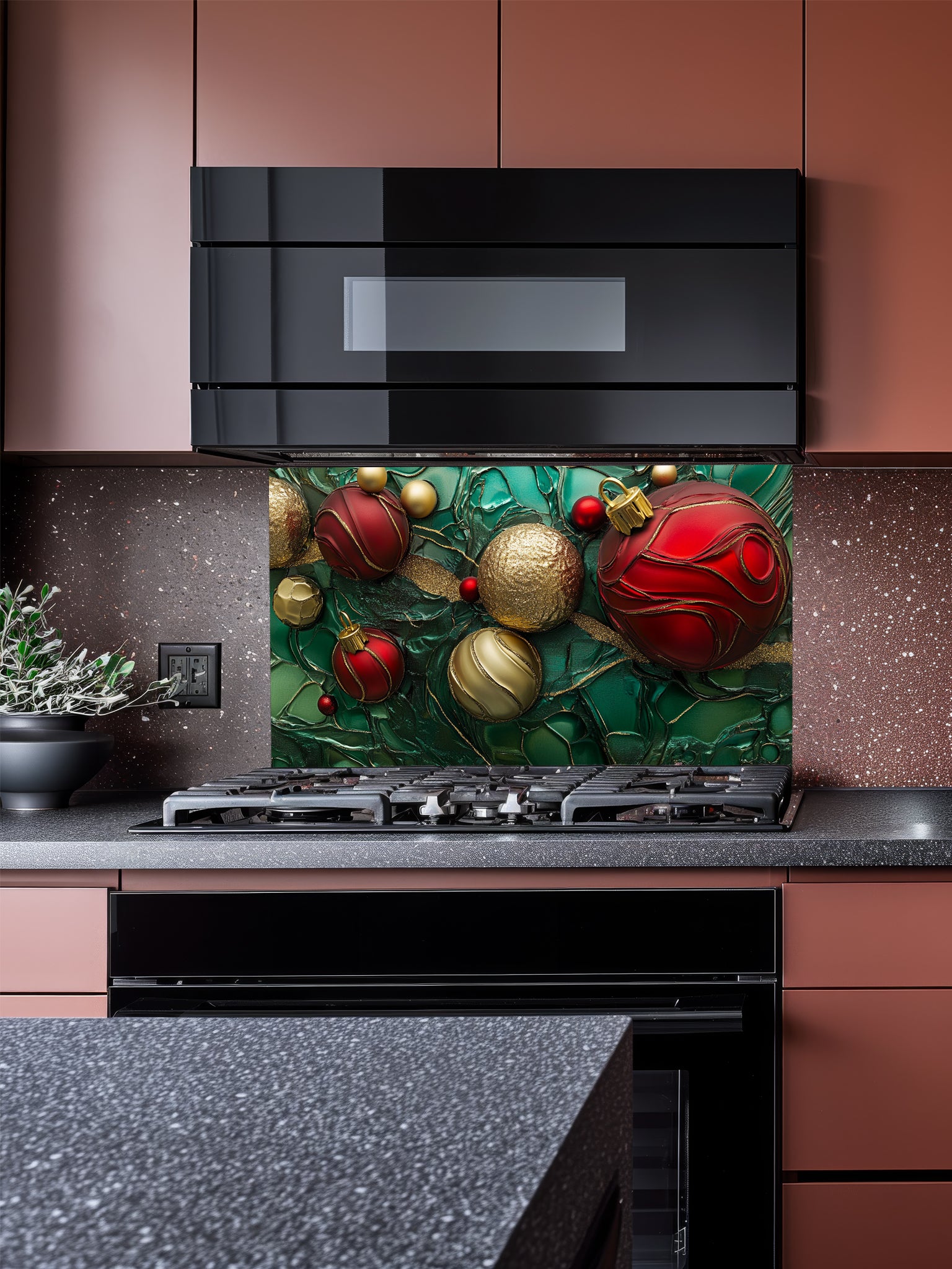 Tempered glass kitchen backsplash featuring a highly realistic 3D illusion of festive red and gold Christmas ornaments and ribbons floating against a deep emerald green marble and fluid art background with golden veins, installed behind a modern stainless steel stove.