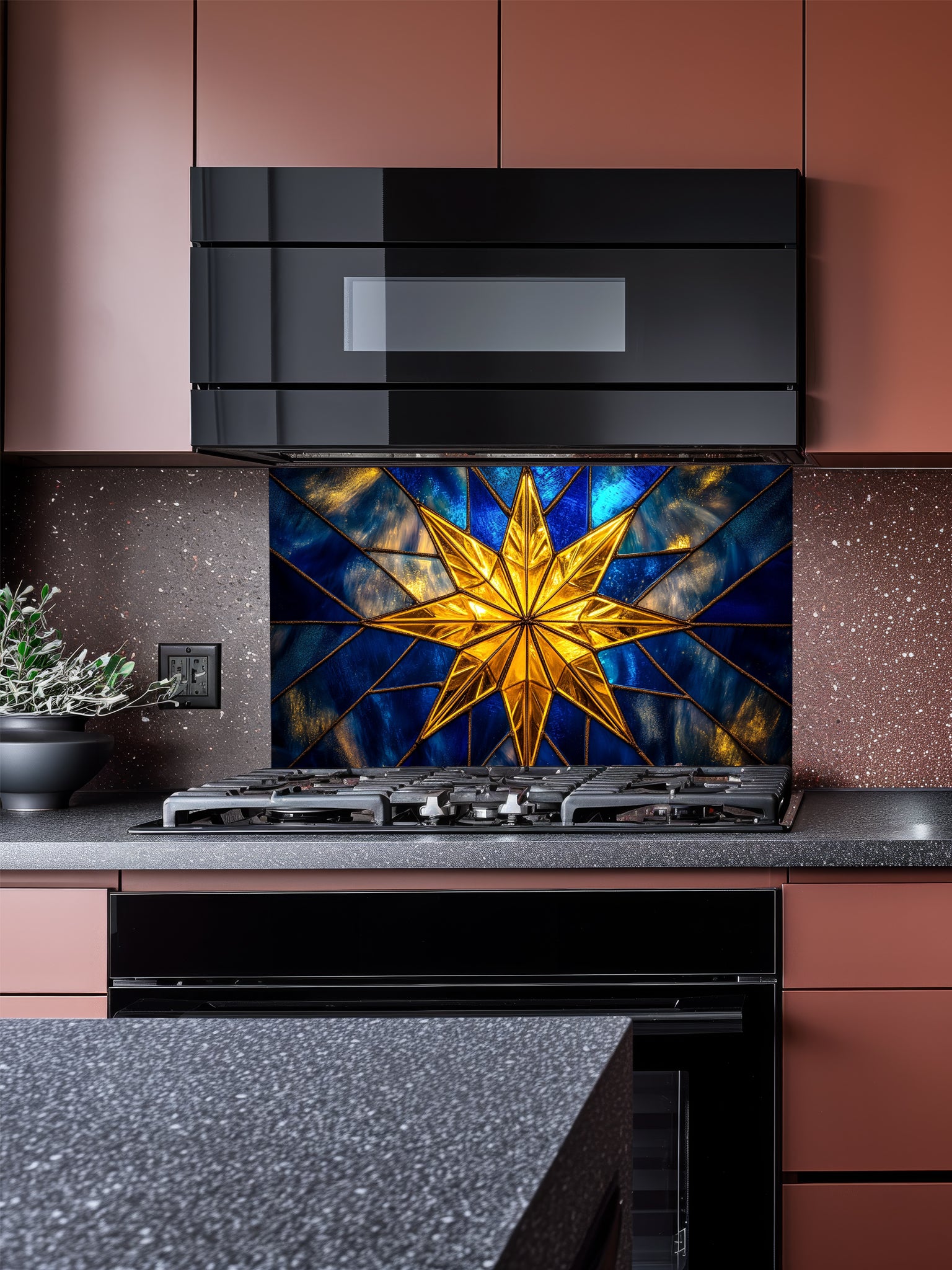 Tempered glass kitchen backsplash featuring a highly realistic 3D illusion of stained glass art showing a brilliant, glowing golden starburst or compass rose radiating against a deep sapphire blue background with faux gold lead lines, installed behind a modern stainless steel stove.