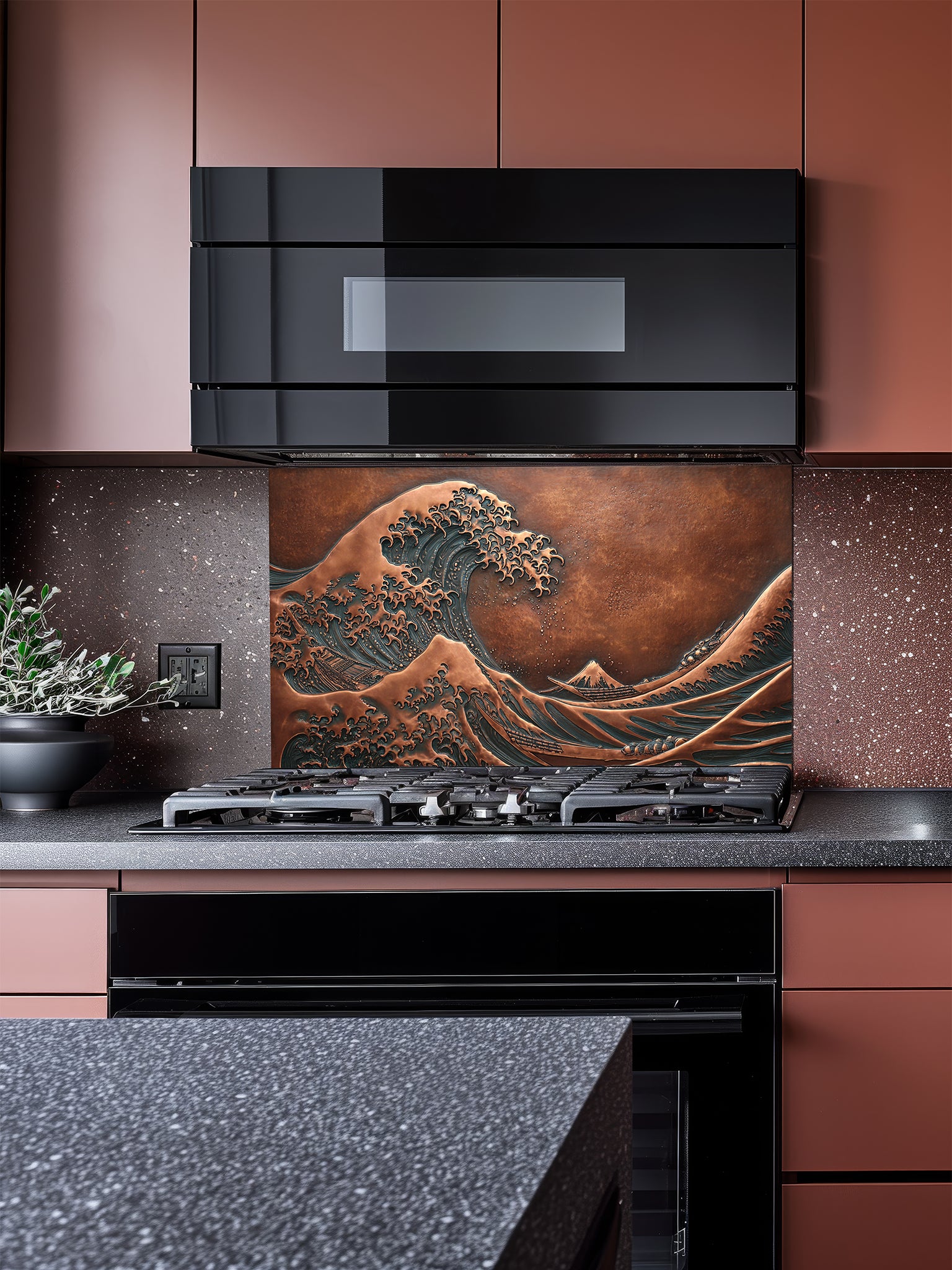 Tempered glass kitchen backsplash featuring a highly realistic 3D faux copper metal relief design of the iconic Great Wave off Kanagawa and Mount Fuji, installed behind a modern stainless steel stove.