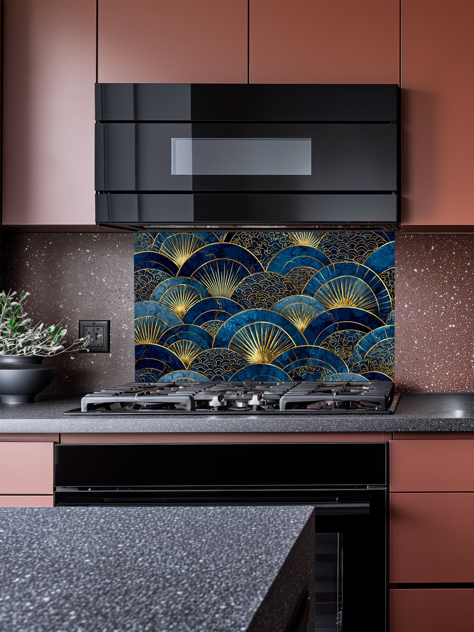 Intricate Japanese Seigaiha wave and Art Deco sunburst fan pattern in deep navy blue and gold, UV printed on a smooth tempered glass kitchen backsplash, installed behind a modern stove.