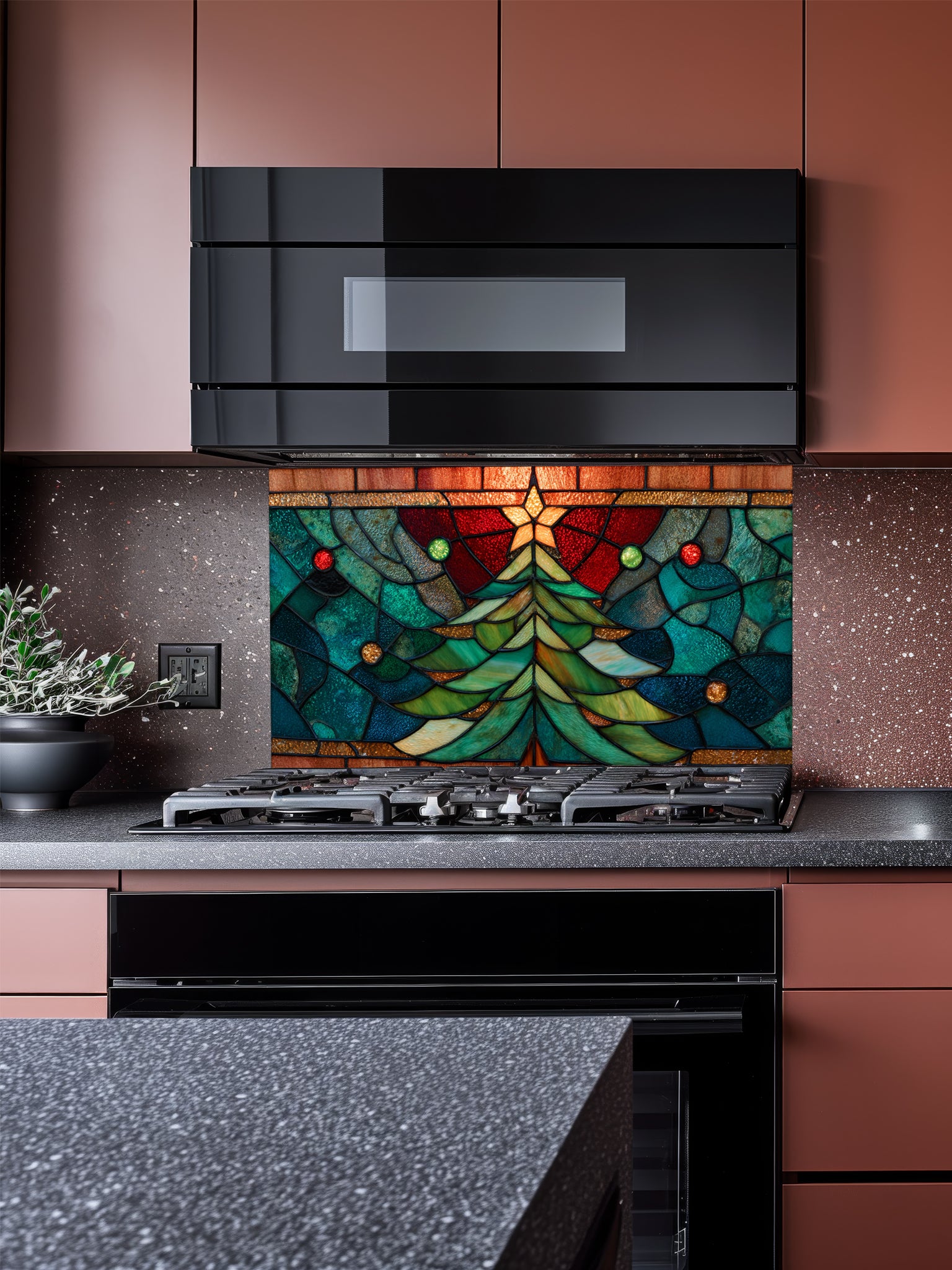 Tempered glass kitchen backsplash featuring a highly realistic 3D illusion of stained glass art showing a festive evergreen Christmas tree decorated with red ornaments and a glowing gold star against a warm amber and blue background, installed behind a modern black stove.