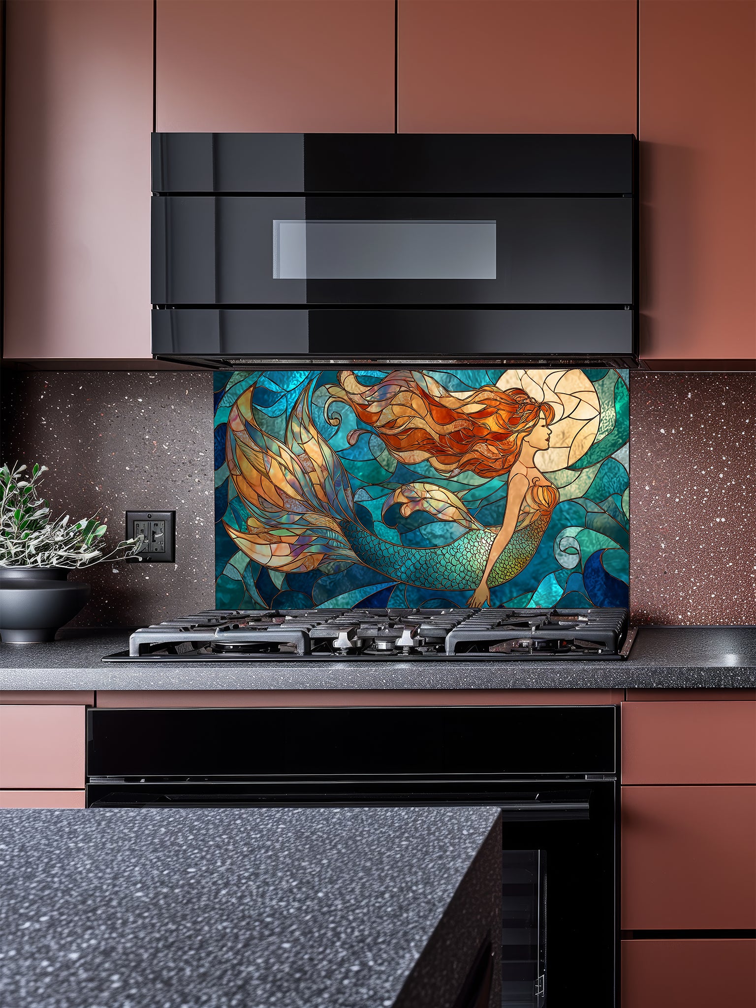 Tempered glass kitchen backsplash featuring a vibrant faux stained glass design of a graceful mermaid with flowing hair swimming in a blue ocean under a glowing moon, installed behind a modern stainless steel stove.