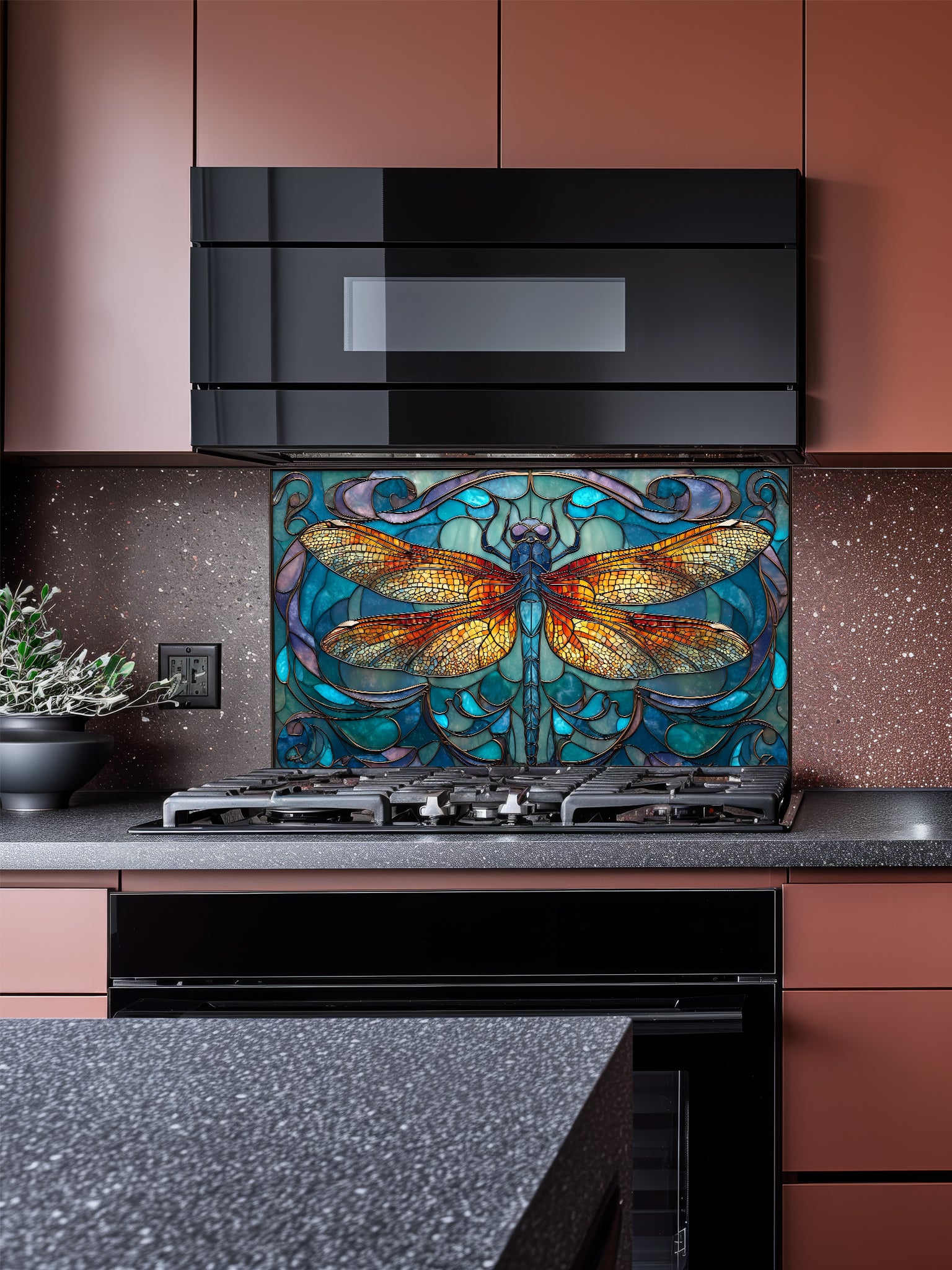Tempered glass kitchen backsplash featuring a highly realistic 3D illusion of Art Nouveau stained glass showing a magnificent, symmetrical dragonfly with vibrant amber and gold wings set against a swirling teal, blue, and purple patterned background, installed behind a modern black stove.
