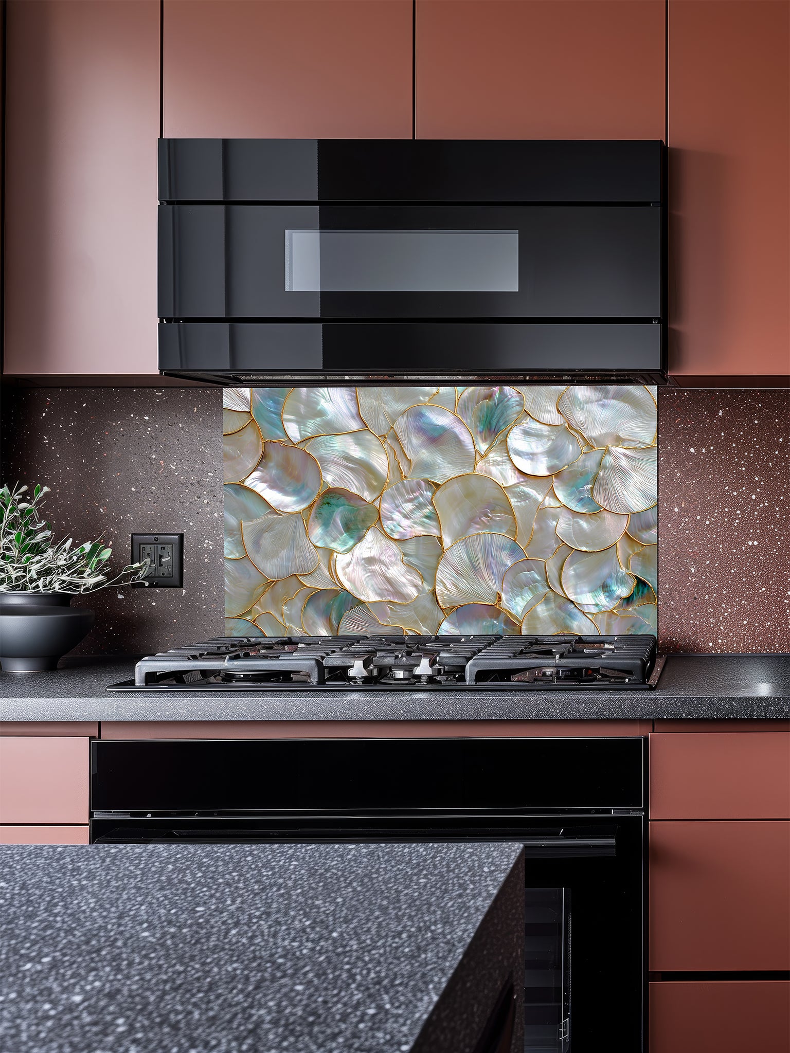 Tempered glass kitchen backsplash featuring a highly realistic 3D faux mosaic design of overlapping mother of pearl and abalone shells with iridescent pastel colors and gold outlines, installed behind a modern stainless steel stove.