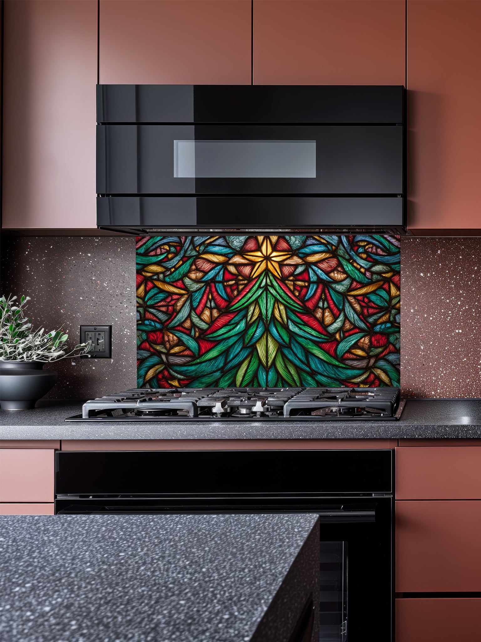 Tempered glass kitchen backsplash featuring a highly realistic 3D illusion of stained glass art showing a vibrant, symmetrical geometric Christmas tree with a glowing gold star at the top in rich jewel tones of emerald green, ruby red, and amber, installed behind a modern black stove.