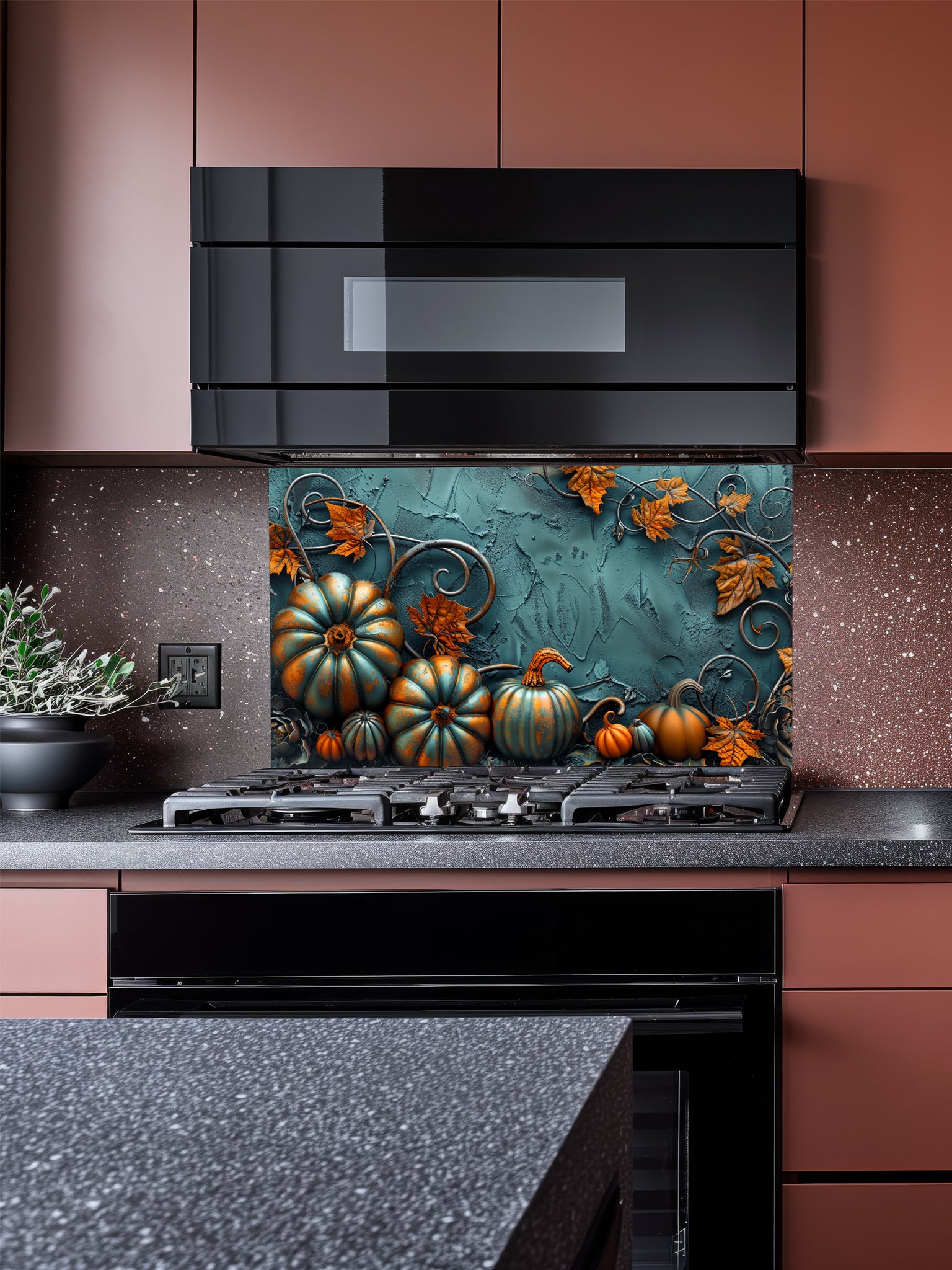 Tempered glass kitchen backsplash featuring a highly realistic 3D illusion of embossed teal and orange pumpkins surrounded by whimsical copper vines and autumn leaves against a textured dark teal background, installed behind a modern black stove.