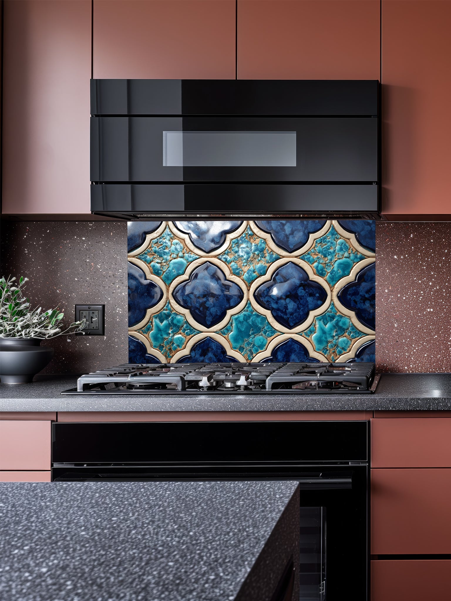 A stylish kitchen featuring a sleek tempered glass backsplash with a highly realistic 3D embossed Moroccan lantern ogee pattern in teal, navy blue, and beige, installed behind a black stove.