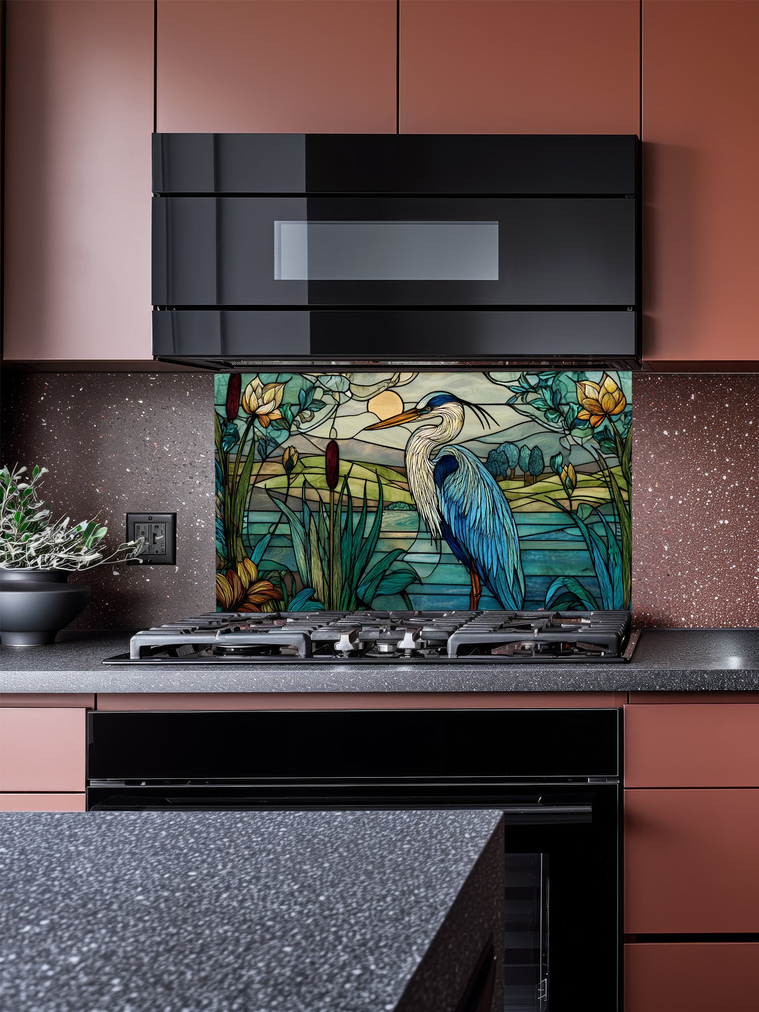 Kitchen with a decorative glass splashback featuring a heron and floral design.