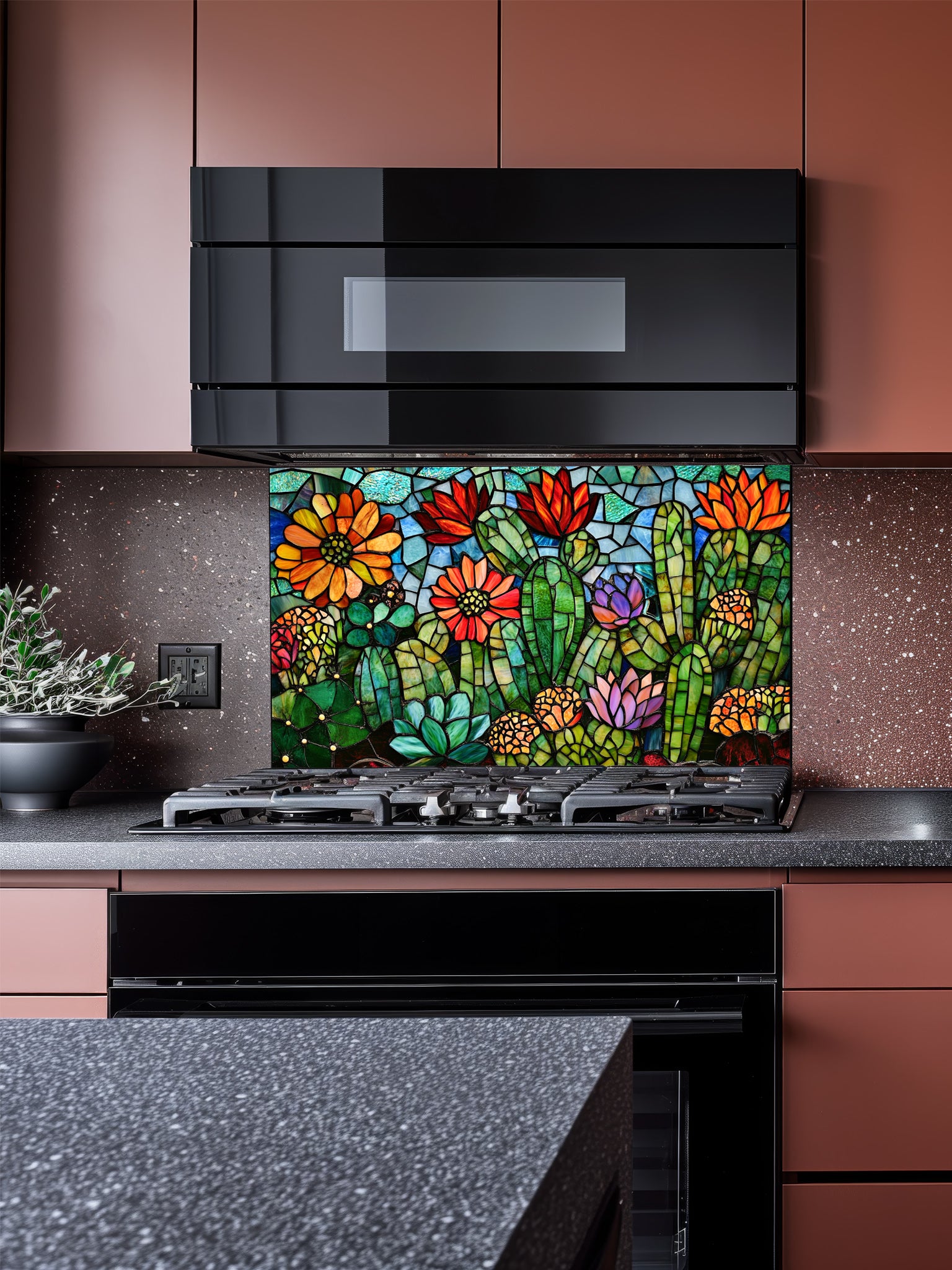 Stained glass style vibrant green cacti with blooming orange, red, and pink flowers in a desert landscape, UV printed on a smooth tempered glass kitchen backsplash, installed behind a modern stove.