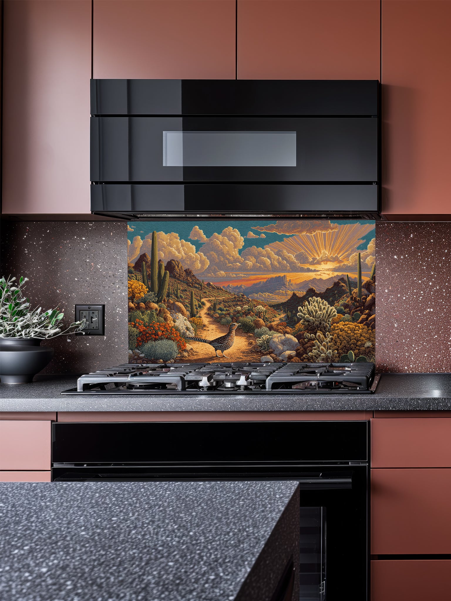 Tempered glass kitchen backsplash featuring a highly realistic 3D illusion of a vintage impasto oil painting showing a beautiful Southwestern desert landscape with a dirt trail, saguaro cacti, blooming flora, a quail, and a radiant sunburst sunset, installed behind a modern black stove.