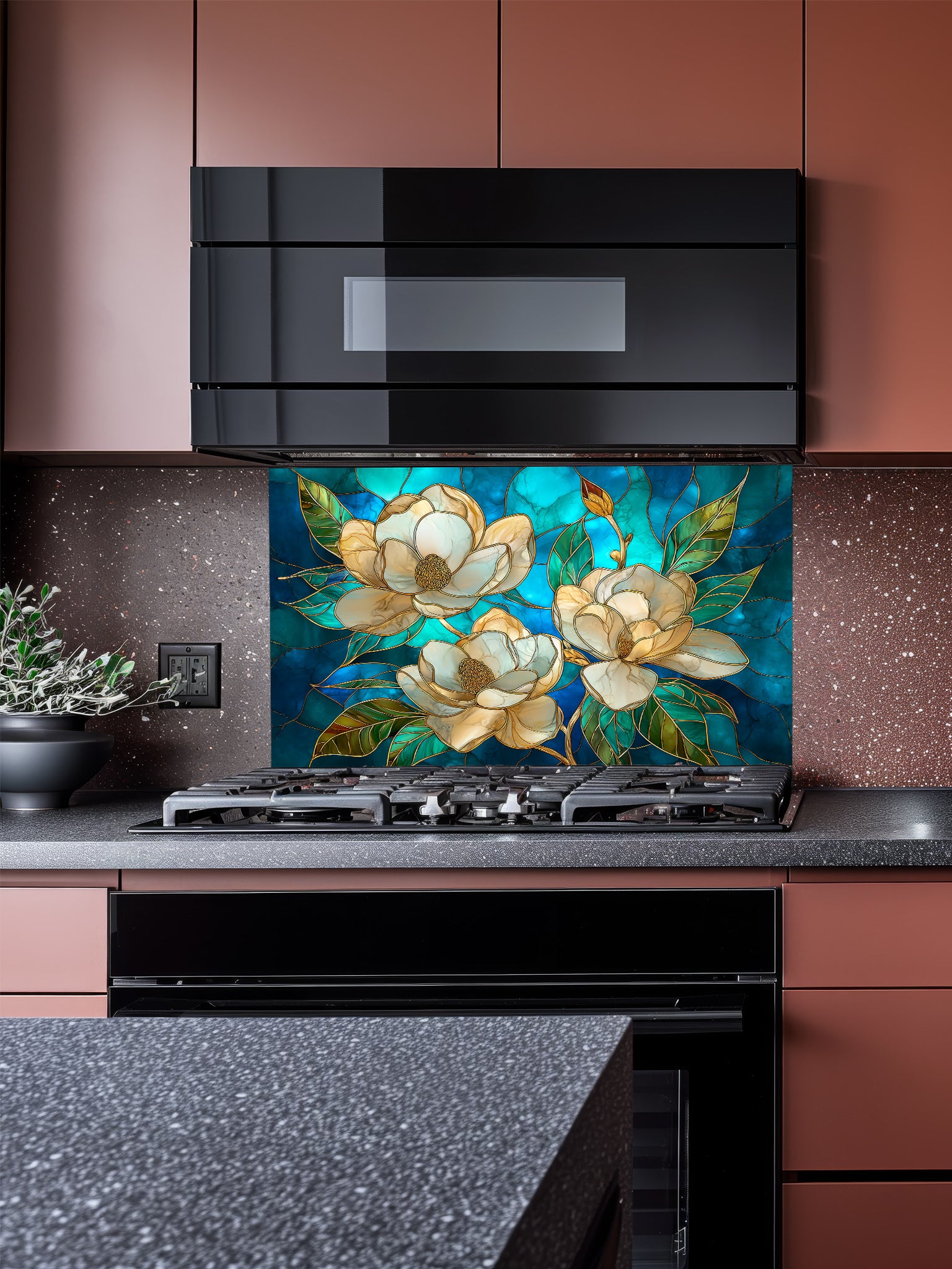 Tempered glass kitchen backsplash featuring a highly realistic 3D illusion of stained glass art showing elegant white magnolia blossoms with gold outlines against a swirling deep blue and teal background, installed behind a modern stainless steel stove.