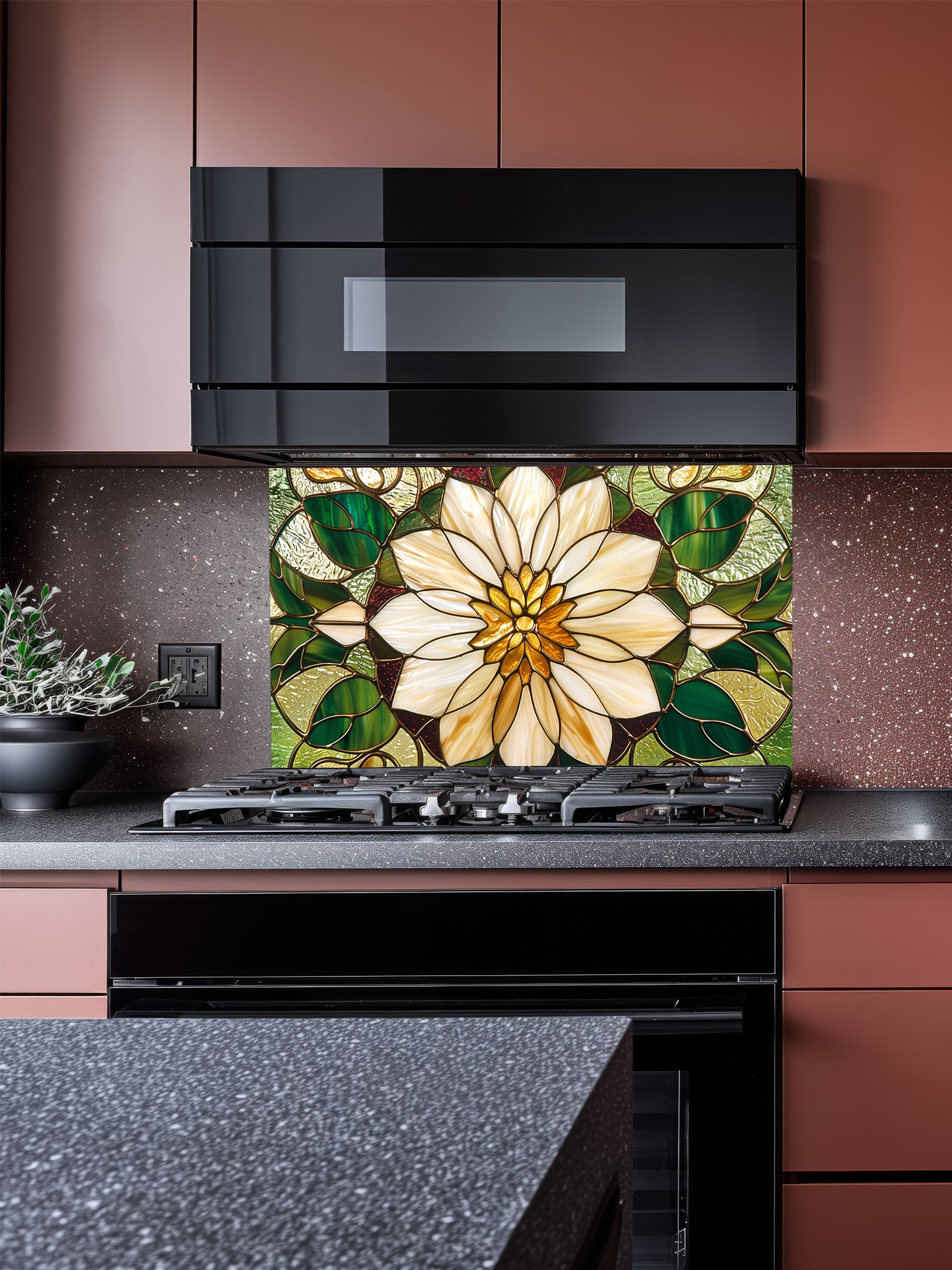 Stained glass style large white flower and rich green leaves UV printed on a smooth tempered glass kitchen backsplash, installed behind a modern stove.