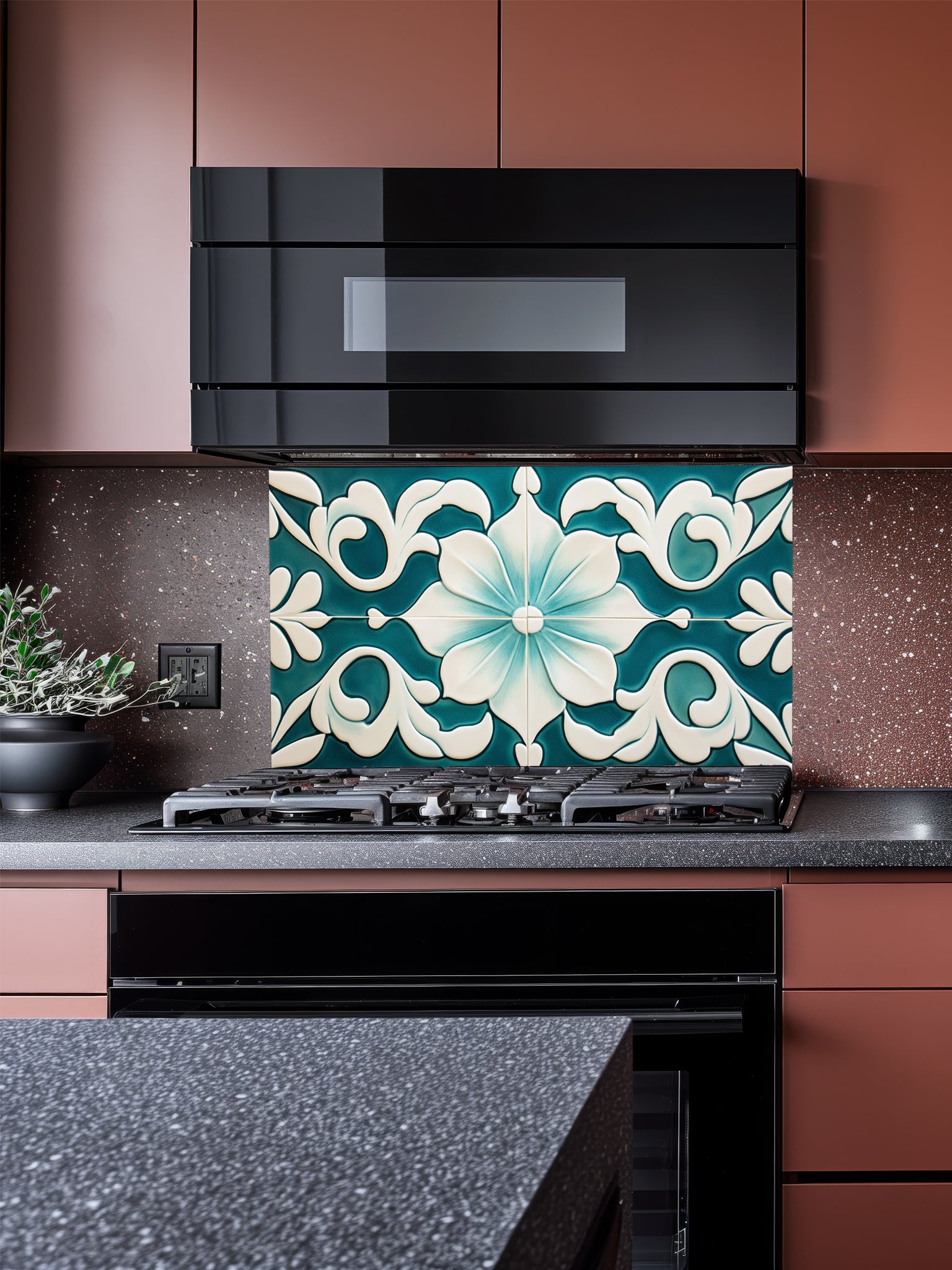 Tempered glass kitchen backsplash featuring a highly realistic illusion of traditional Mediterranean or Talavera tiles, showcasing a large, elegant floral or lotus pattern in deep teal and creamy ivory, installed behind a modern black stove.
