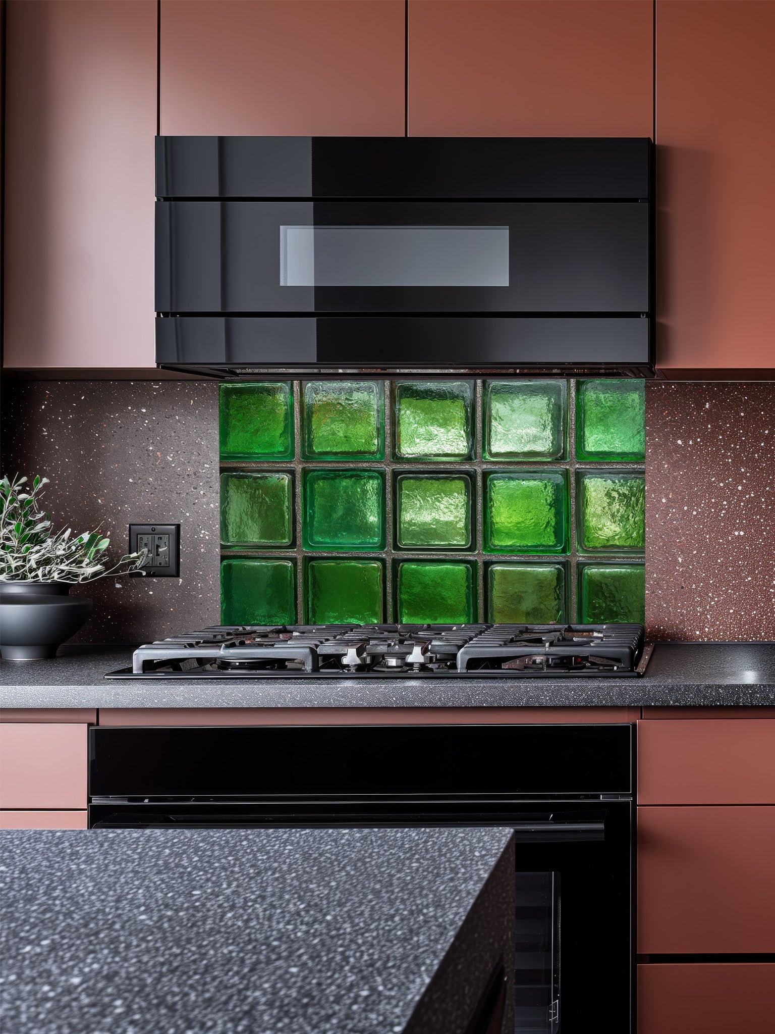 Faux green glass block 3D effect UV printed on a smooth tempered glass kitchen backsplash, installed behind a modern stove.