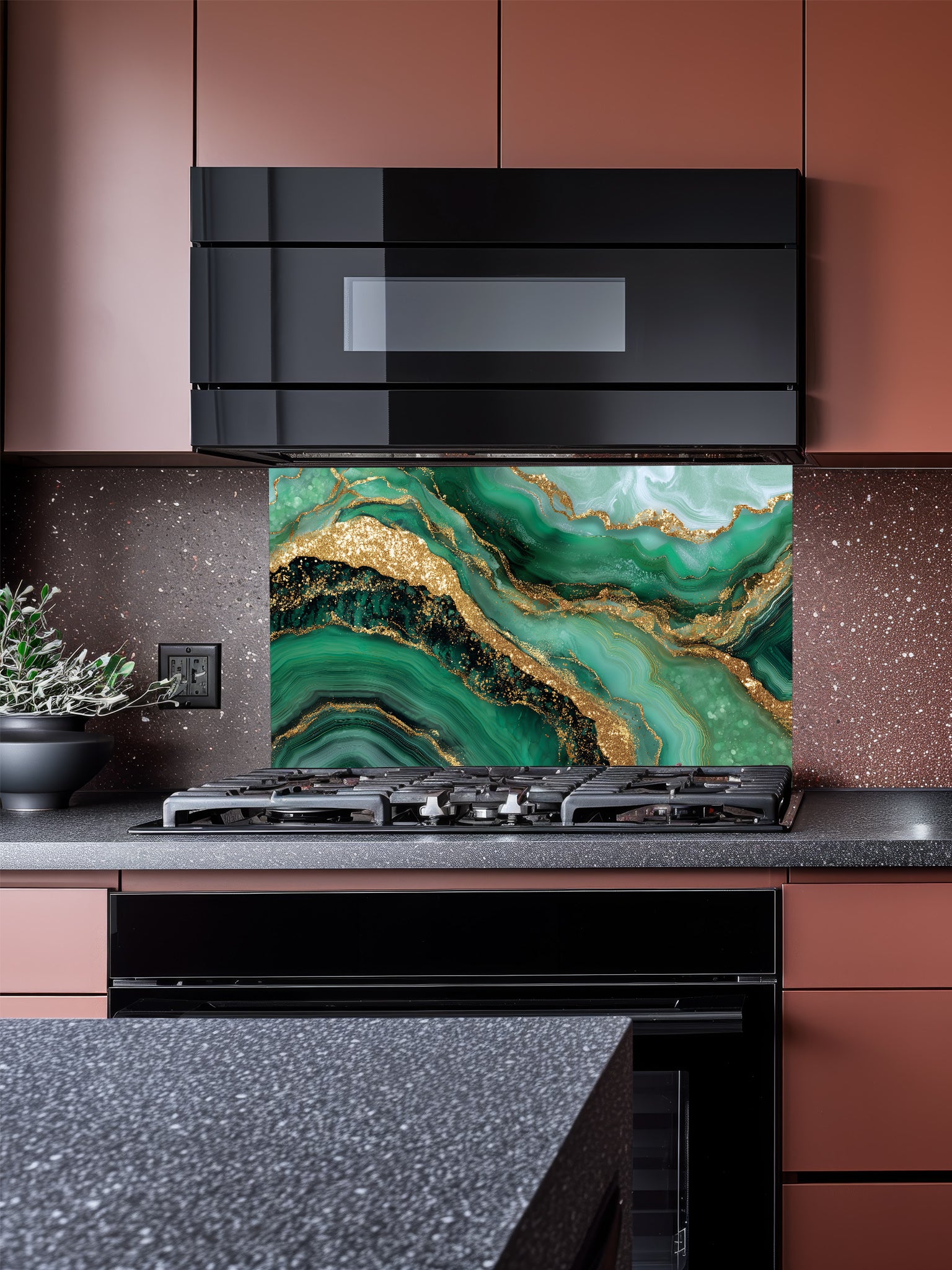 Tempered glass kitchen backsplash featuring a highly realistic illusion of emerald green and gold agate fluid art with faux glitter veins, installed behind a modern stainless steel stove.