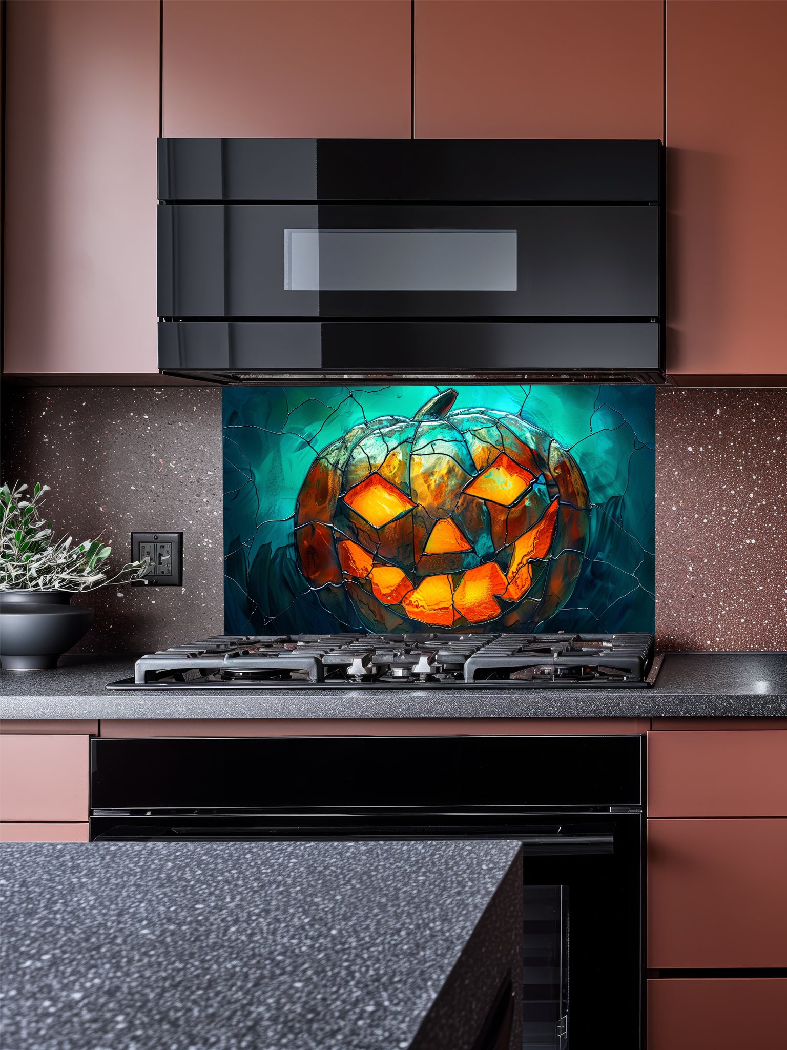 Tempered glass kitchen backsplash featuring a highly realistic 3D illusion of stained glass art showing a spooky Jack-o'-lantern pumpkin with glowing fiery orange eyes and mouth against a dark teal cracked glass background, installed behind a modern black stove.