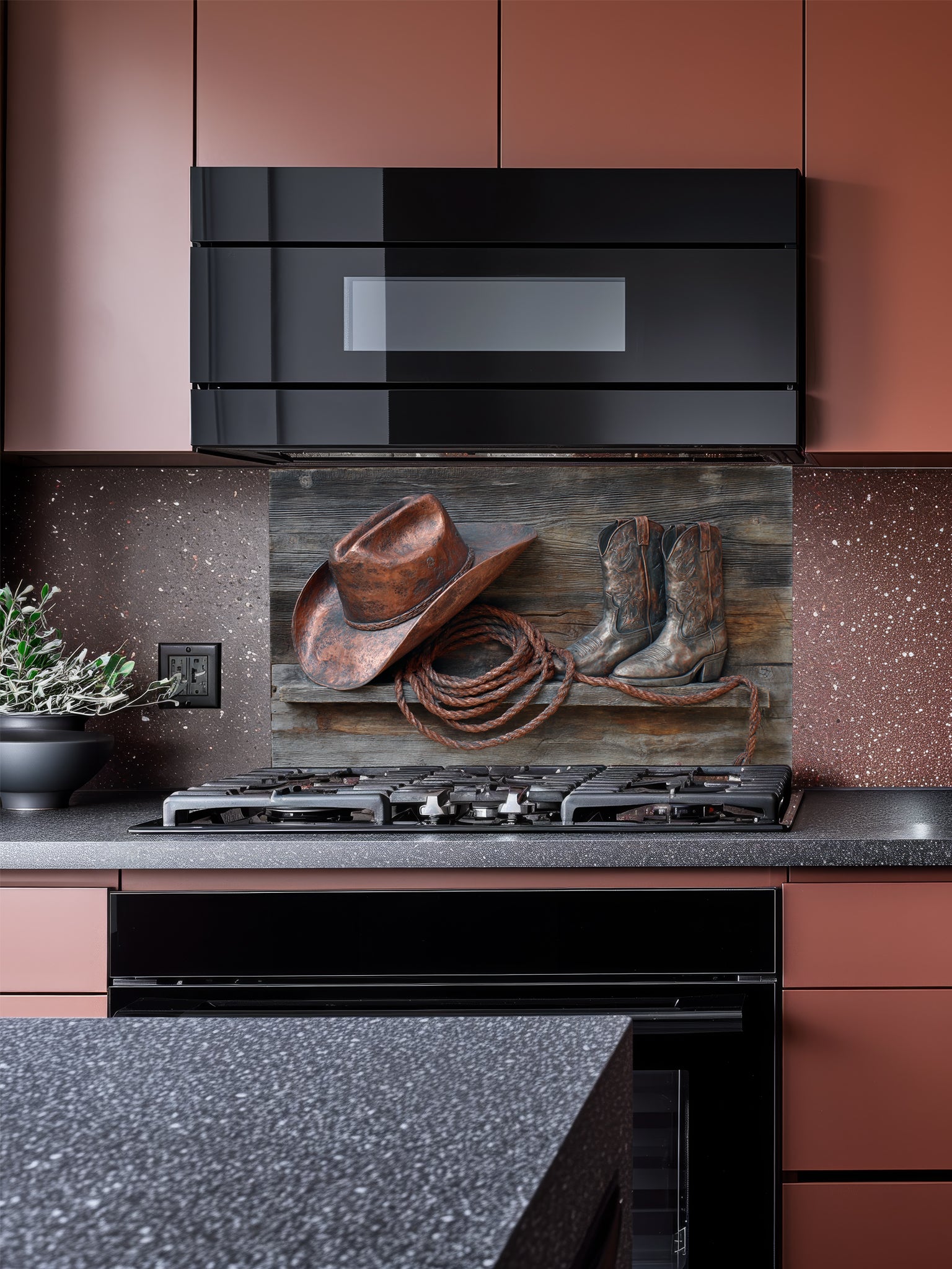 Tempered glass kitchen backsplash featuring a highly realistic 3D illusion of a rustic wooden shelf displaying a copper cowboy hat, worn leather boots, and a lasso rope against a weathered barn wood background, installed behind a modern black stove.