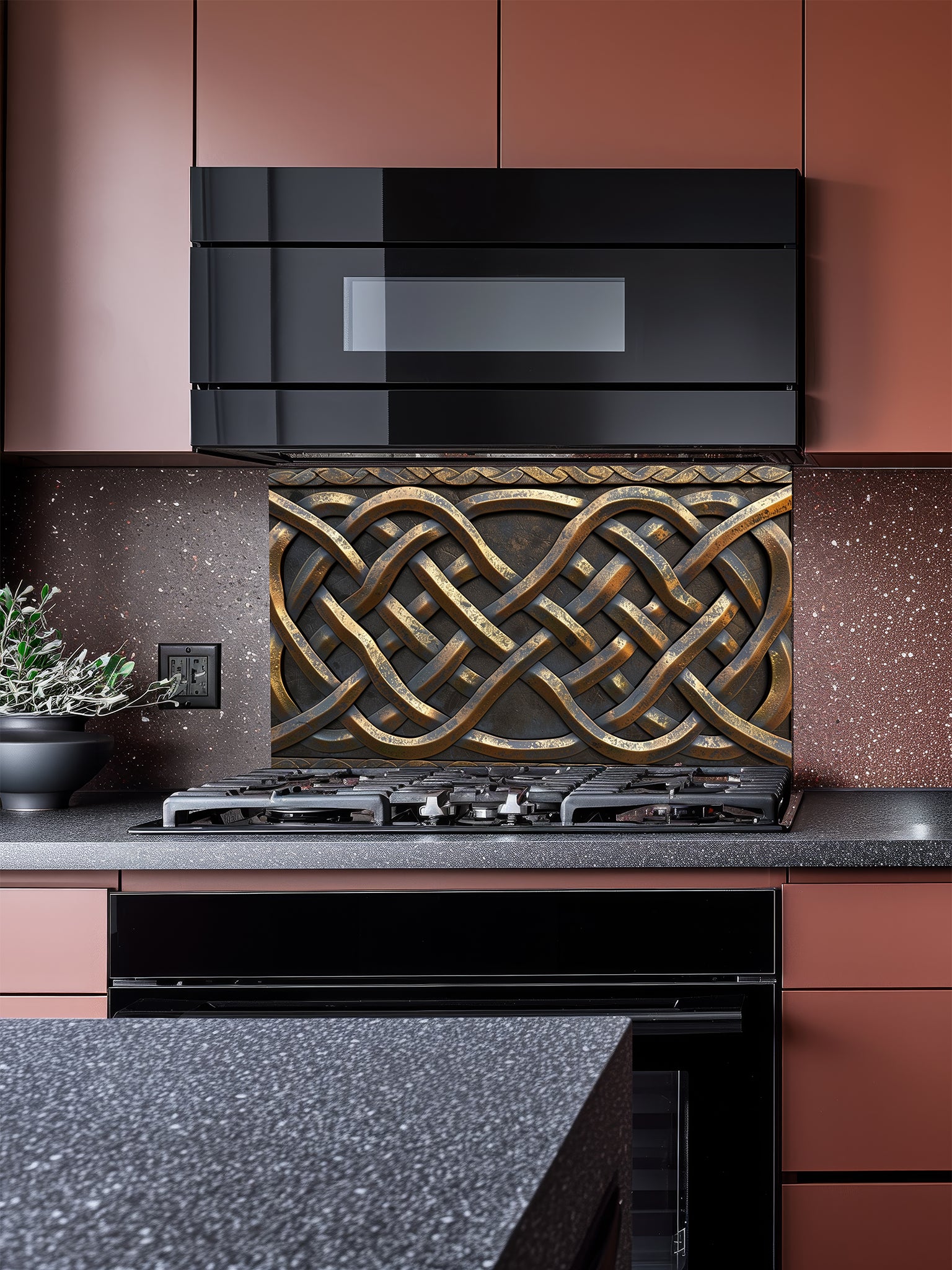 Tempered glass kitchen backsplash featuring a highly realistic 3D faux metal design of intricate interlaced Celtic knots in antique bronze and dark iron tones, installed behind a modern stainless steel stove.
