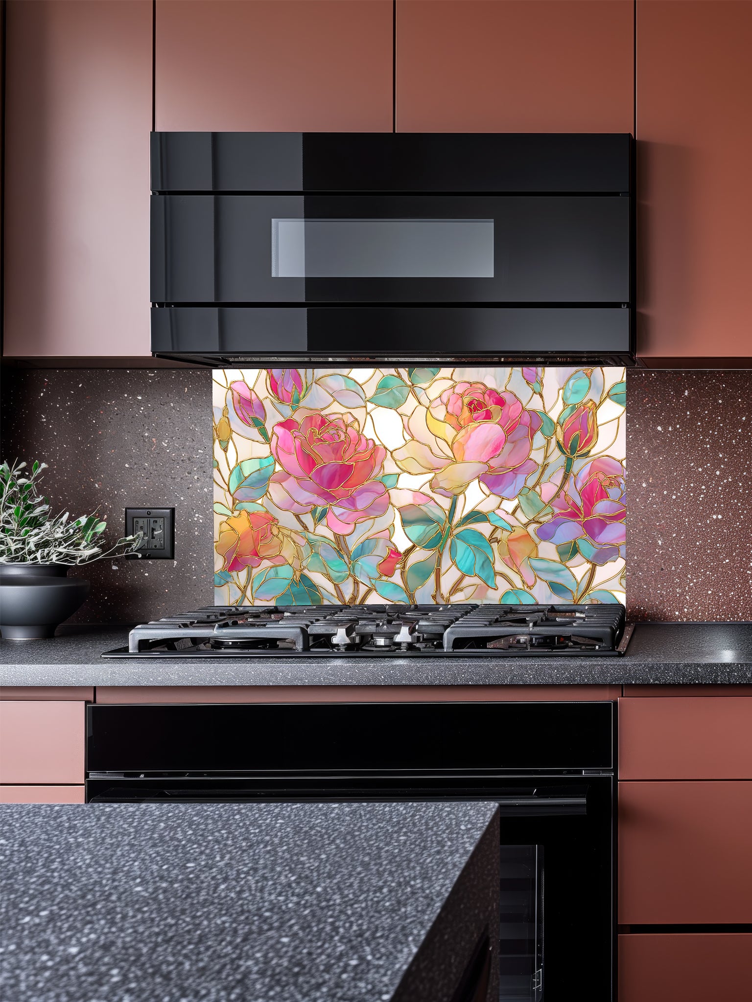 Tempered glass kitchen backsplash featuring a highly realistic 3D illusion of stained glass art showing large, elegant blooming pink and magenta roses with teal and green leaves, beautifully outlined in faux gold, installed behind a modern black stove.