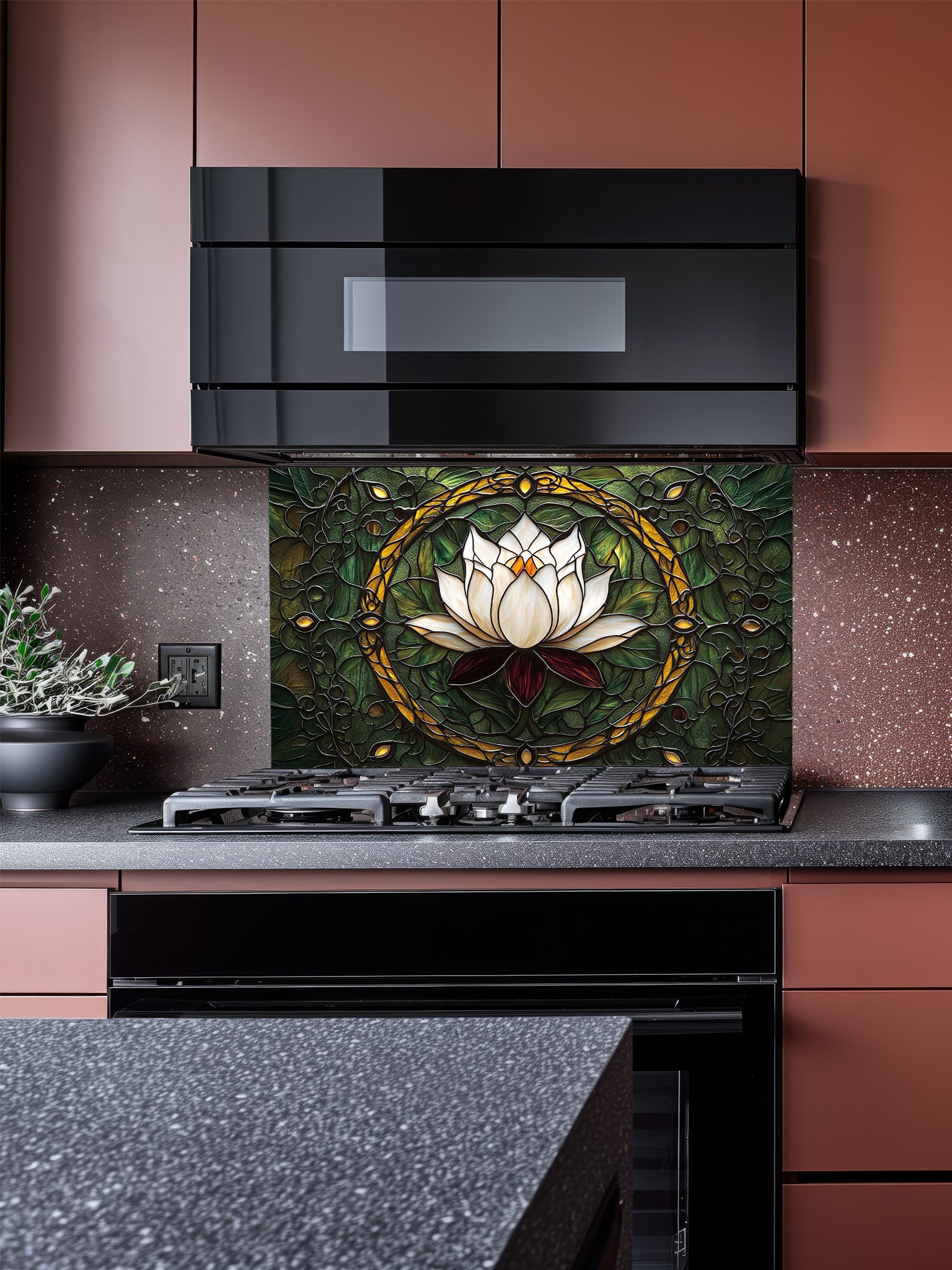 Stained glass style white lotus flower and green botanical pattern UV printed on tempered glass kitchen backsplash, installed behind a modern stove.