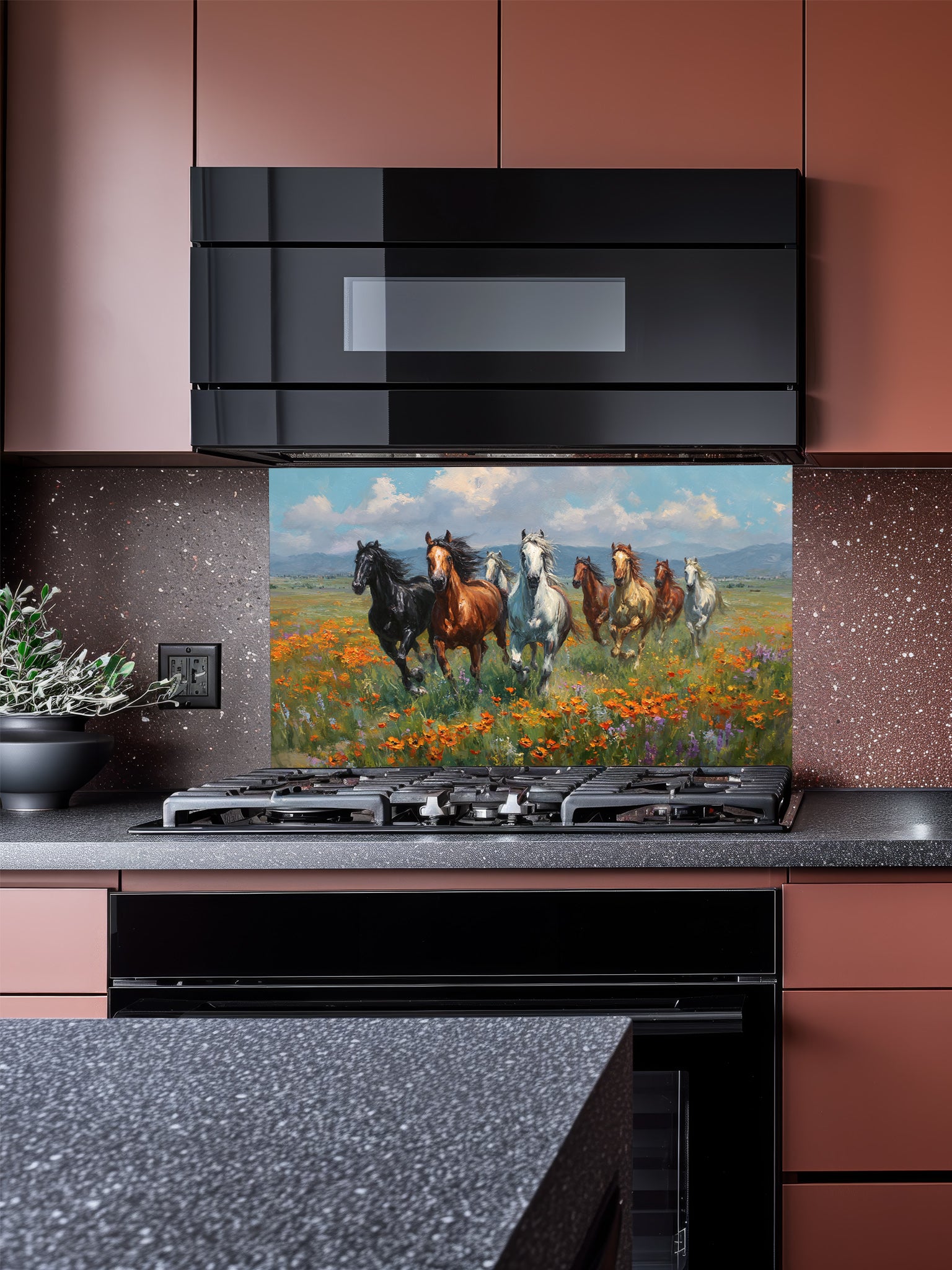 Kitchen with a decorative glass backsplash featuring horses and flowers