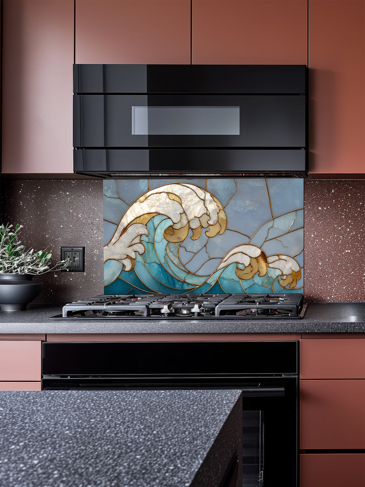 Tempered glass kitchen backsplash featuring a dramatic crashing ocean wave design in faux stained glass with deep blue water, white foam crests, and elegant gold outlines, installed behind a modern stainless steel stove.