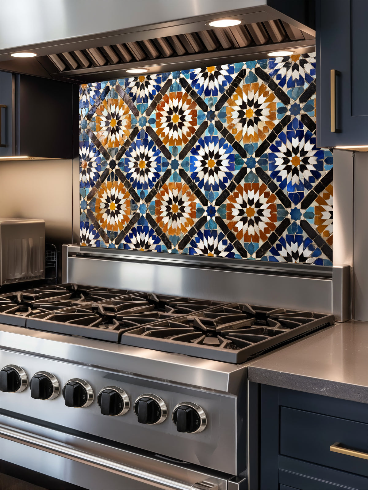 Stainless steel stove with decorative mosaic tile backsplash in a kitchen setting