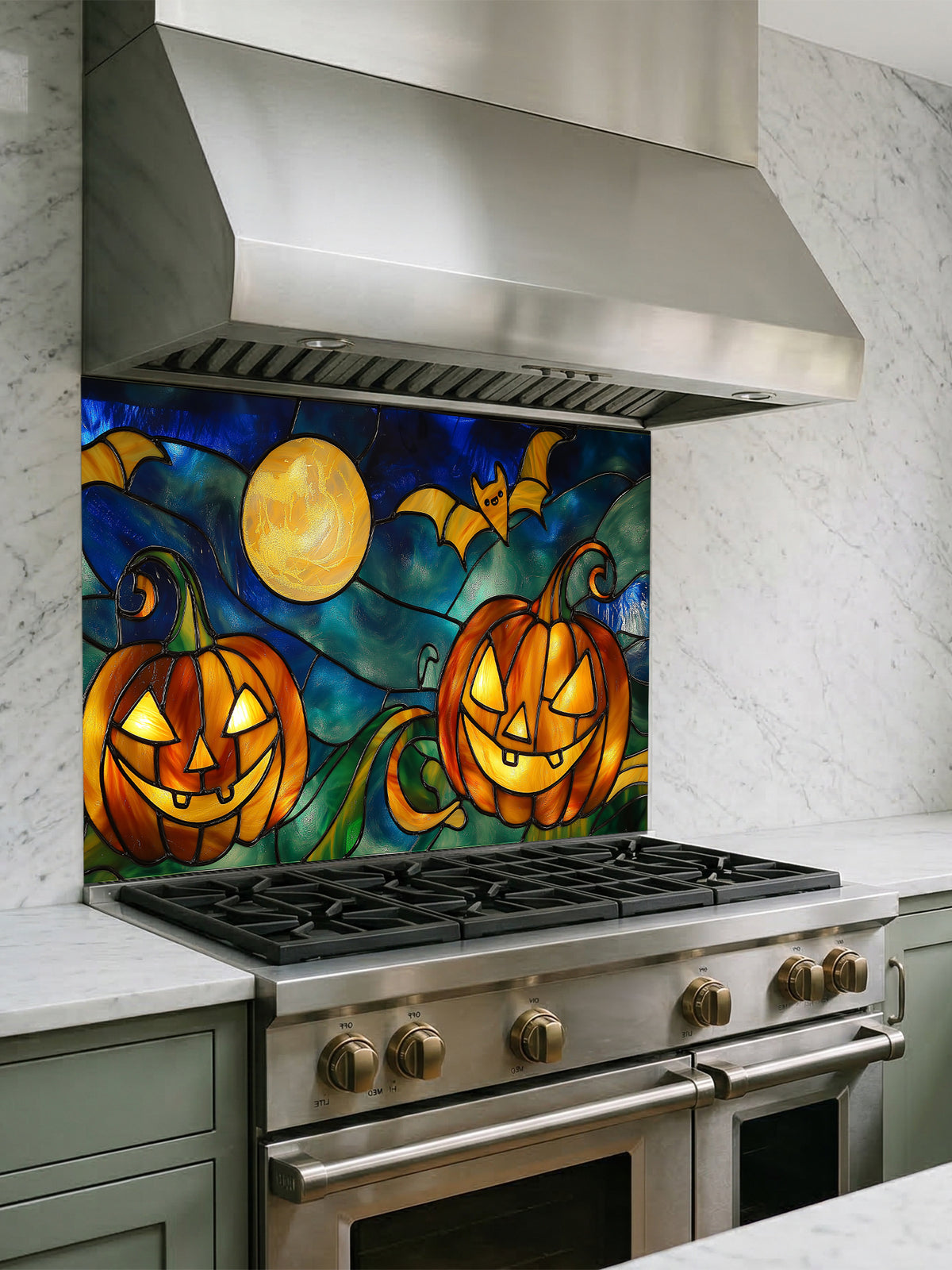 Stainless steel range with Halloween-themed glass backsplash featuring jack-o'-lanterns and a full moon.