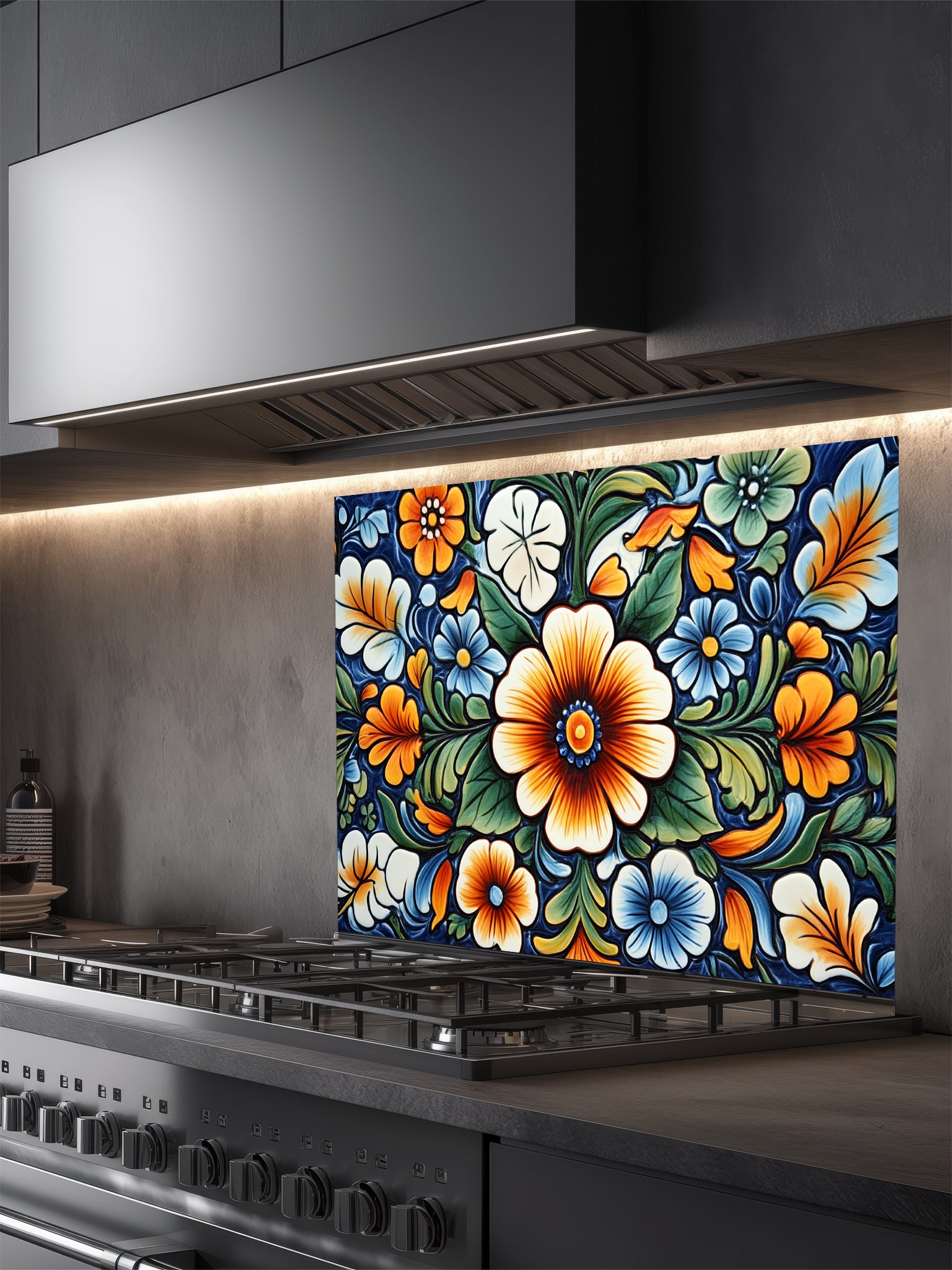 Vibrant Mexican Talavera style floral pattern in blue, orange, and green, UV printed on a smooth tempered glass kitchen backsplash, installed behind a modern stove.