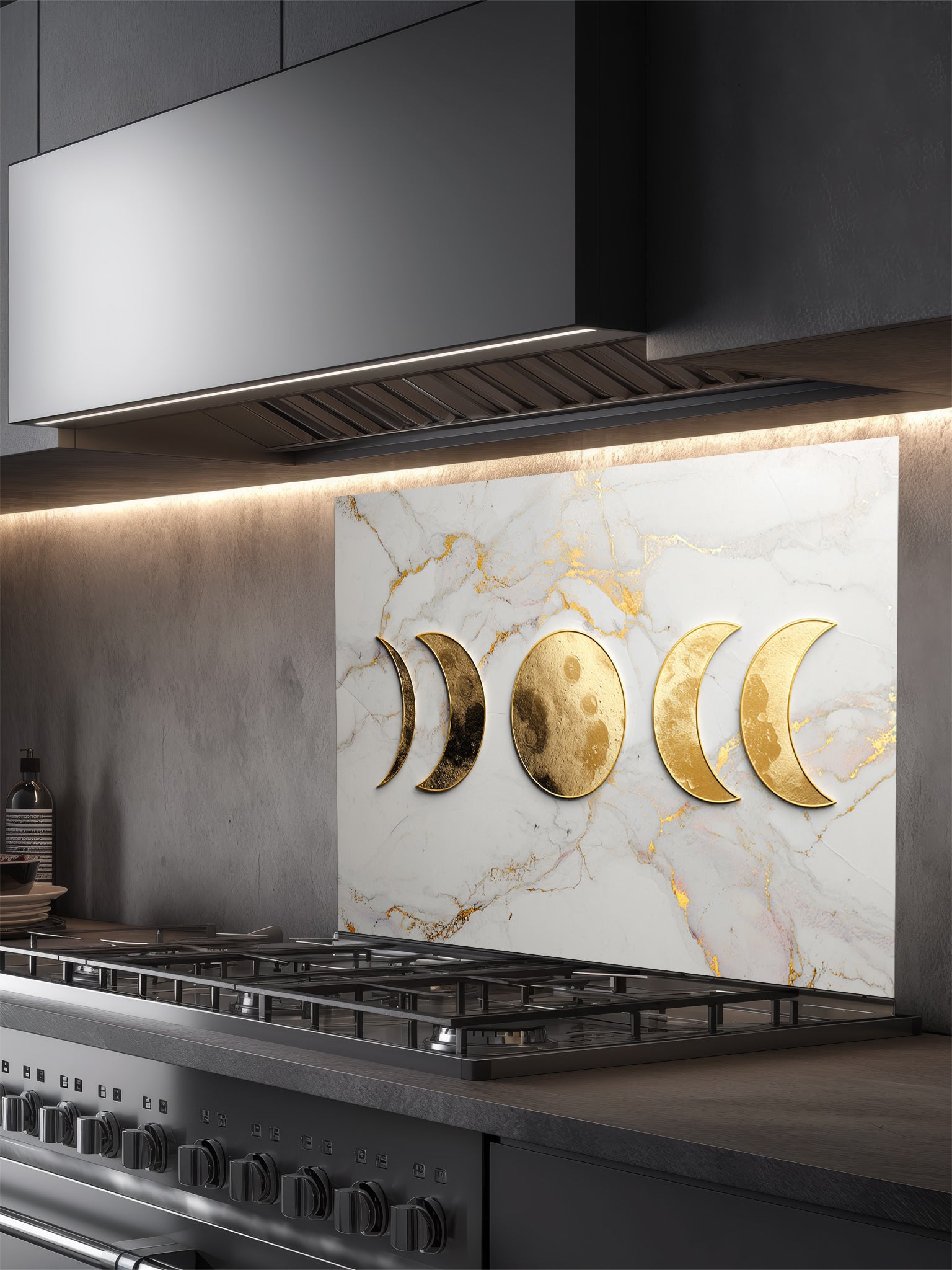 Faux 3D effect textured metallic gold moon phases on an elegant white and gold veined marble background, UV printed on a smooth tempered glass kitchen backsplash, installed behind a modern stove.