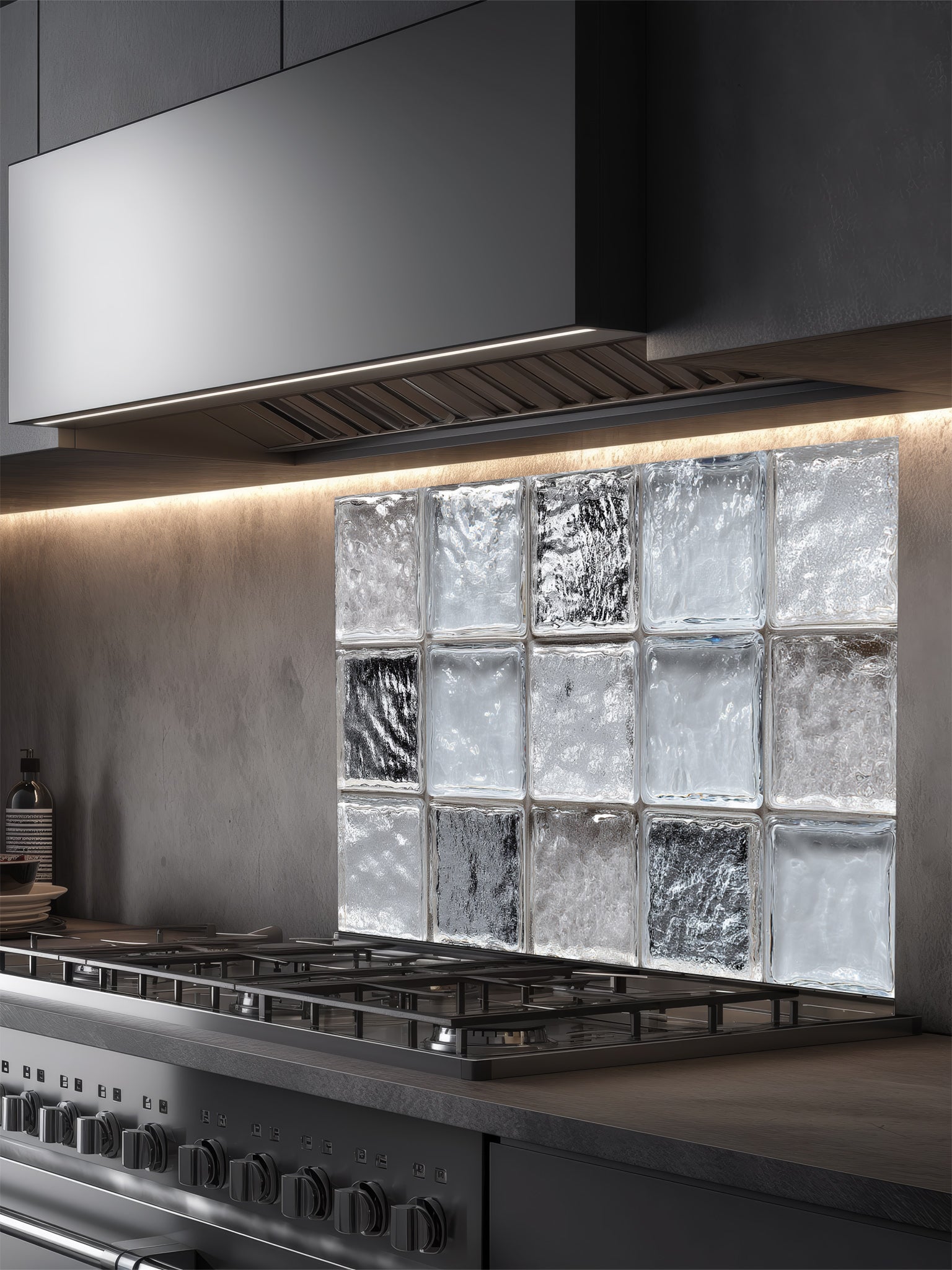 Faux clear glass block and ice texture 3D effect UV printed on a smooth tempered glass kitchen backsplash, installed behind a modern stove.