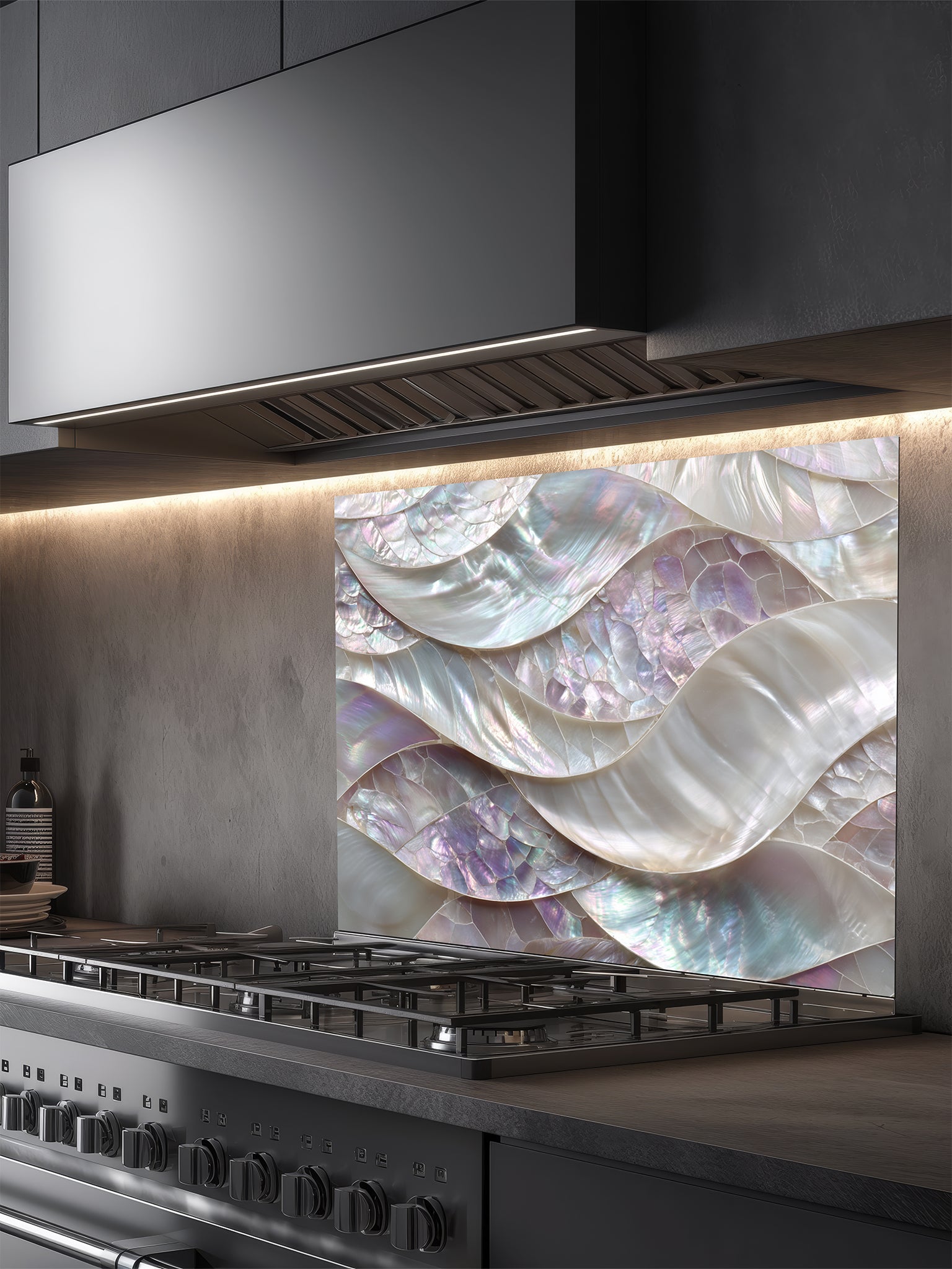 Tempered glass kitchen backsplash featuring a highly realistic 3D faux mosaic design of continuous flowing waves of mother of pearl shells with iridescent pastel colors, installed behind a modern stainless steel stove.